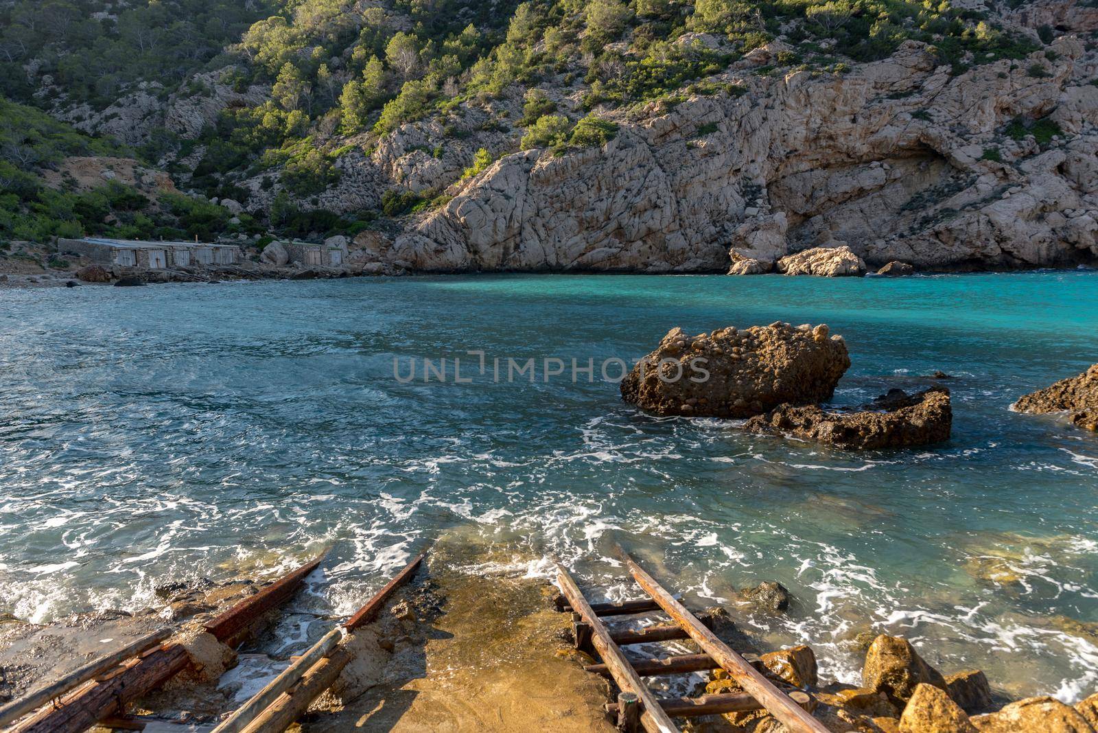 Turquoise waters in Es Portitxol, Ibiza, Spain. Hidden bay on the Island of Ibiza, in Sant Joan de Labritja.