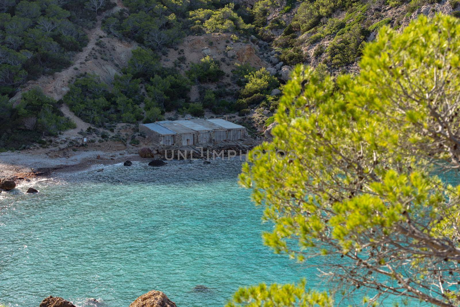 Turquoise waters in Es Portitxol, Ibiza, Spain. Hidden bay on the Island of Ibiza, in Sant Joan de Labritja.