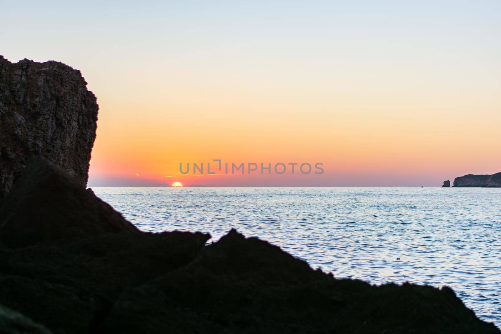 Beautiful Sunset in Cala Comte Beach, Sant Antoni de Portmany, Ibiza, Balearic Islands, Spain by martinscphoto
