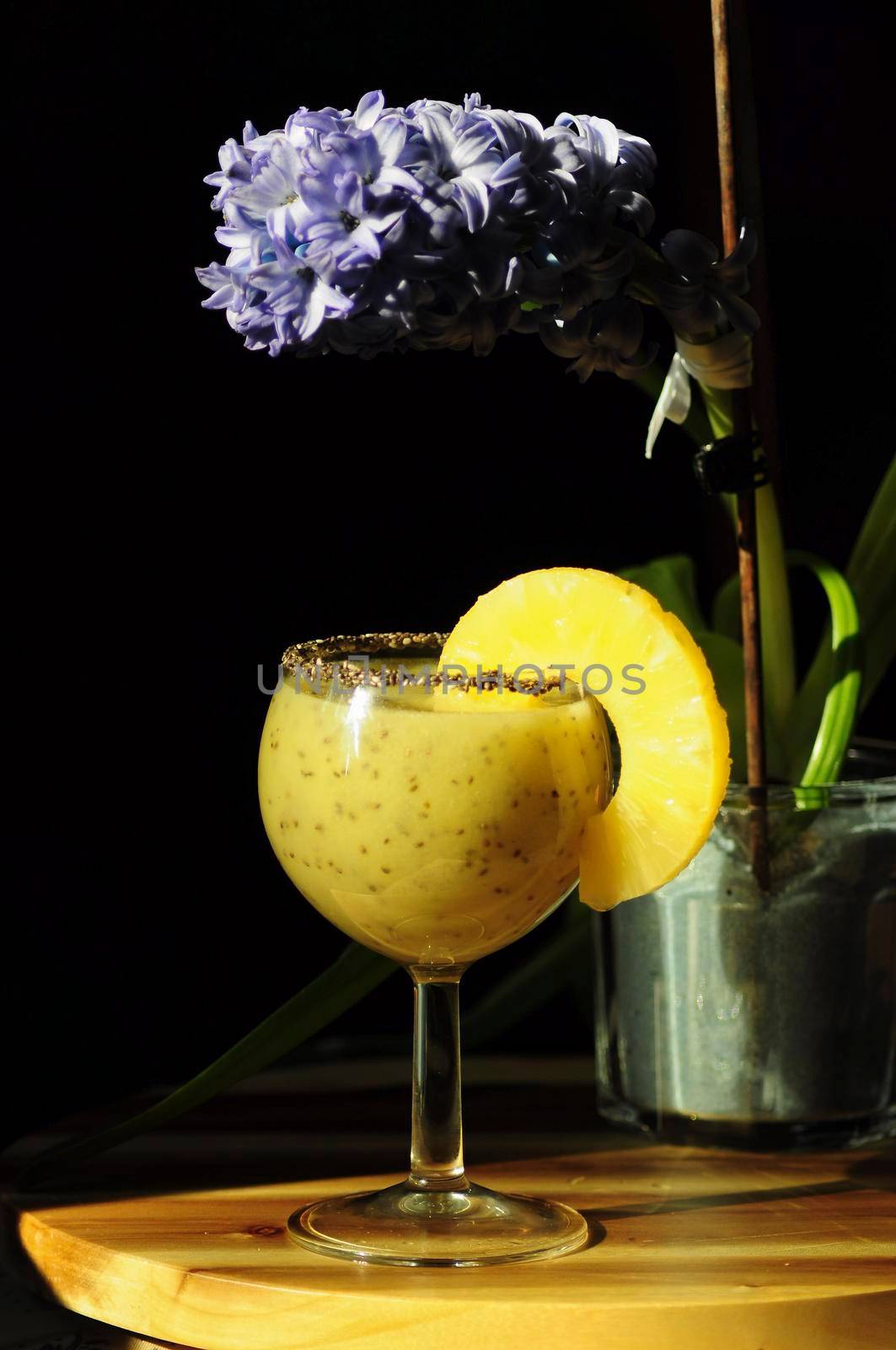 bright yellow breakfast smoothie with pineapple, kiwi and chia seeds on a dark background, healthy eating, still life, High quality photo