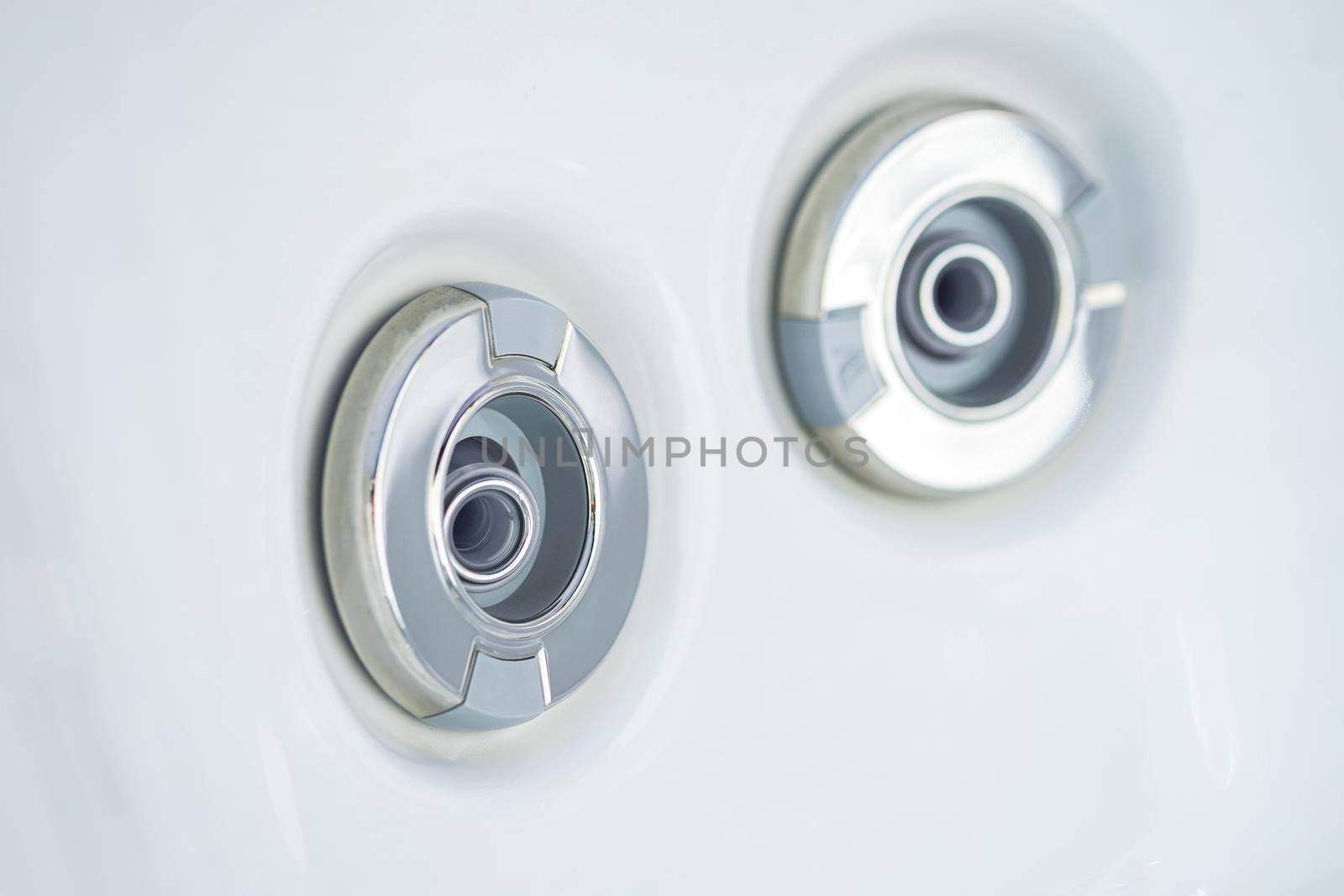 view of the high pressure nozzles of a bath tub at spa with headrest