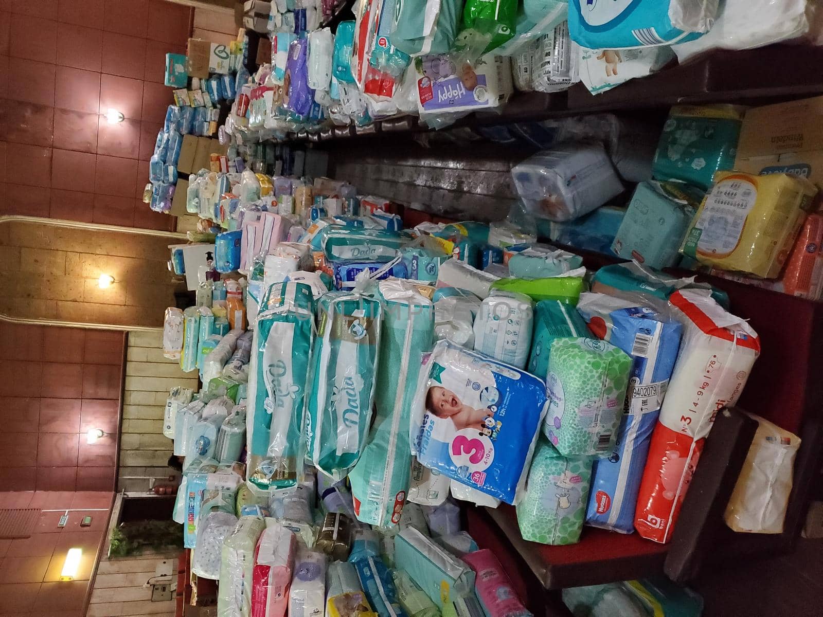 Pile of diapers and other diapers in the warehouse of the volunteer center by Try_my_best