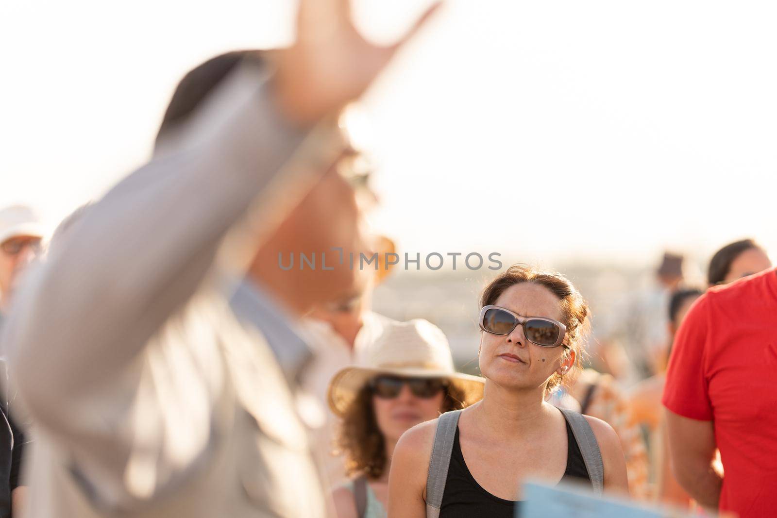 Tourists listening to the explanations of a guide at the Egyptian temple of Kom Ombo