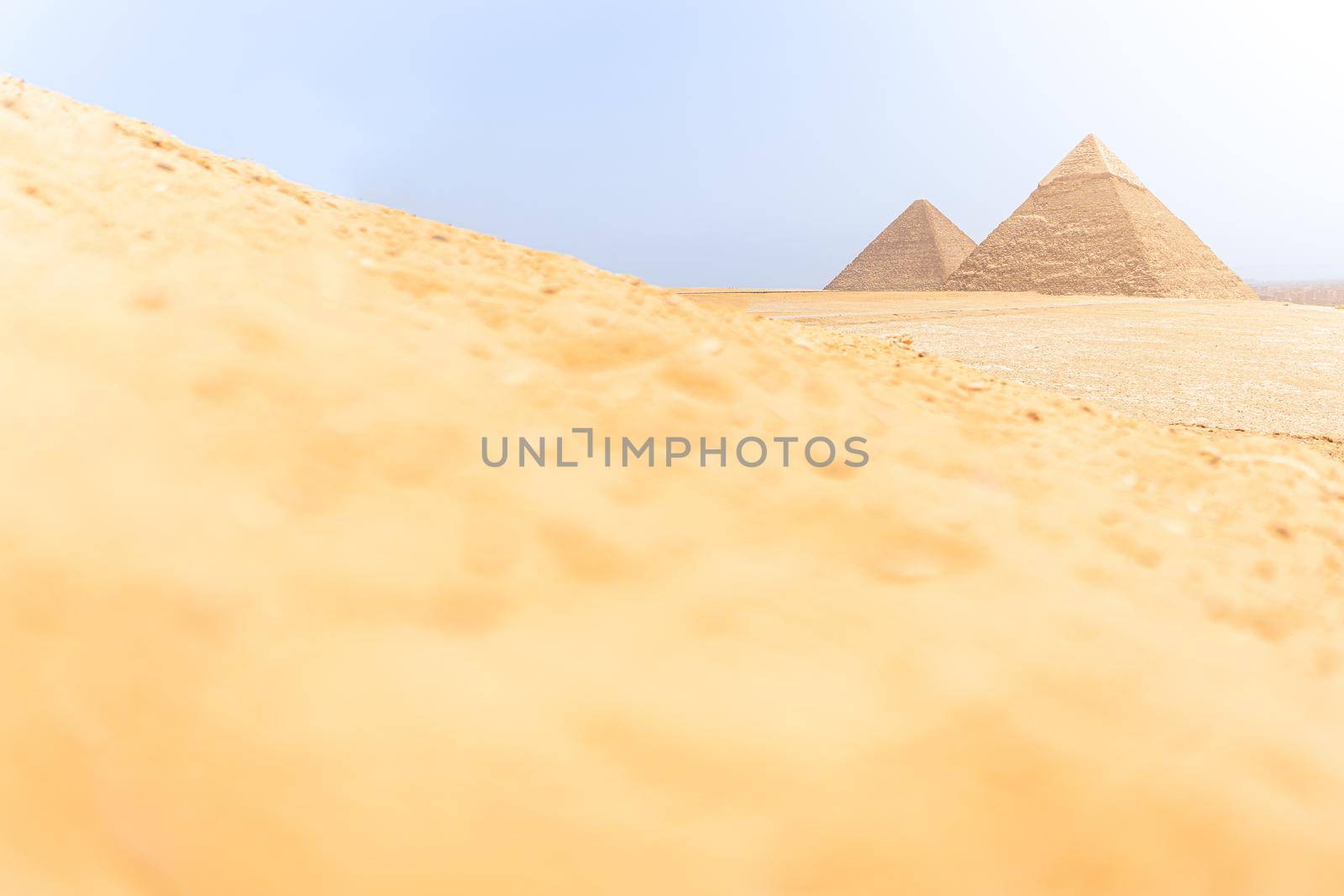 Focus on the pyramids of Giza in Egypt next to the dunes of the desert