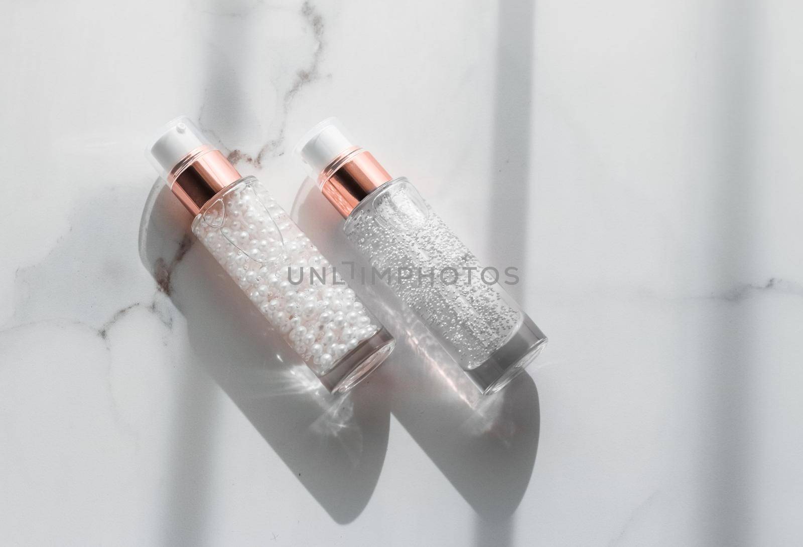 Cosmetic branding, packaging and make-up concept - Skin care serum and gel bottle, moisturizing lotion and lifting cream emulsion on marble, anti-age cosmetics for luxury beauty skincare brand design