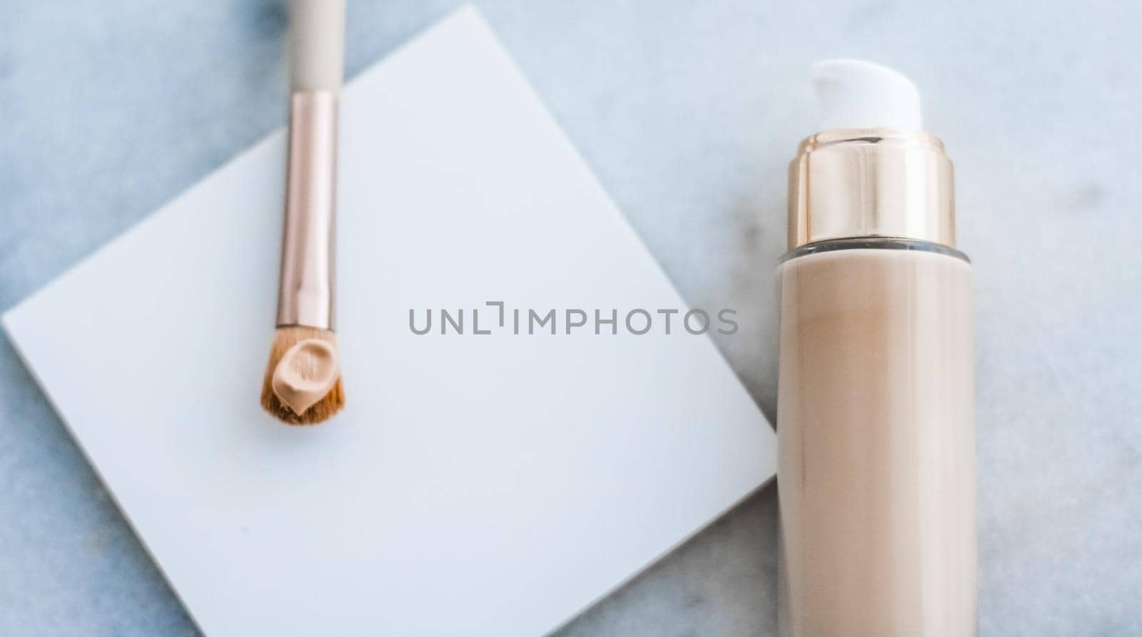 Cosmetic branding, glamour and skincare concept - Makeup foundation bottle and contouring brush on marble, make-up concealer bb cream as cosmetics product for luxury beauty brand holiday design