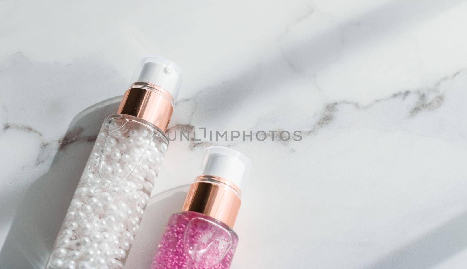 Cosmetic branding, packaging and make-up concept - Skin care serum and gel bottle, moisturizing lotion and lifting cream emulsion on marble, anti-age cosmetics for luxury beauty skincare brand design