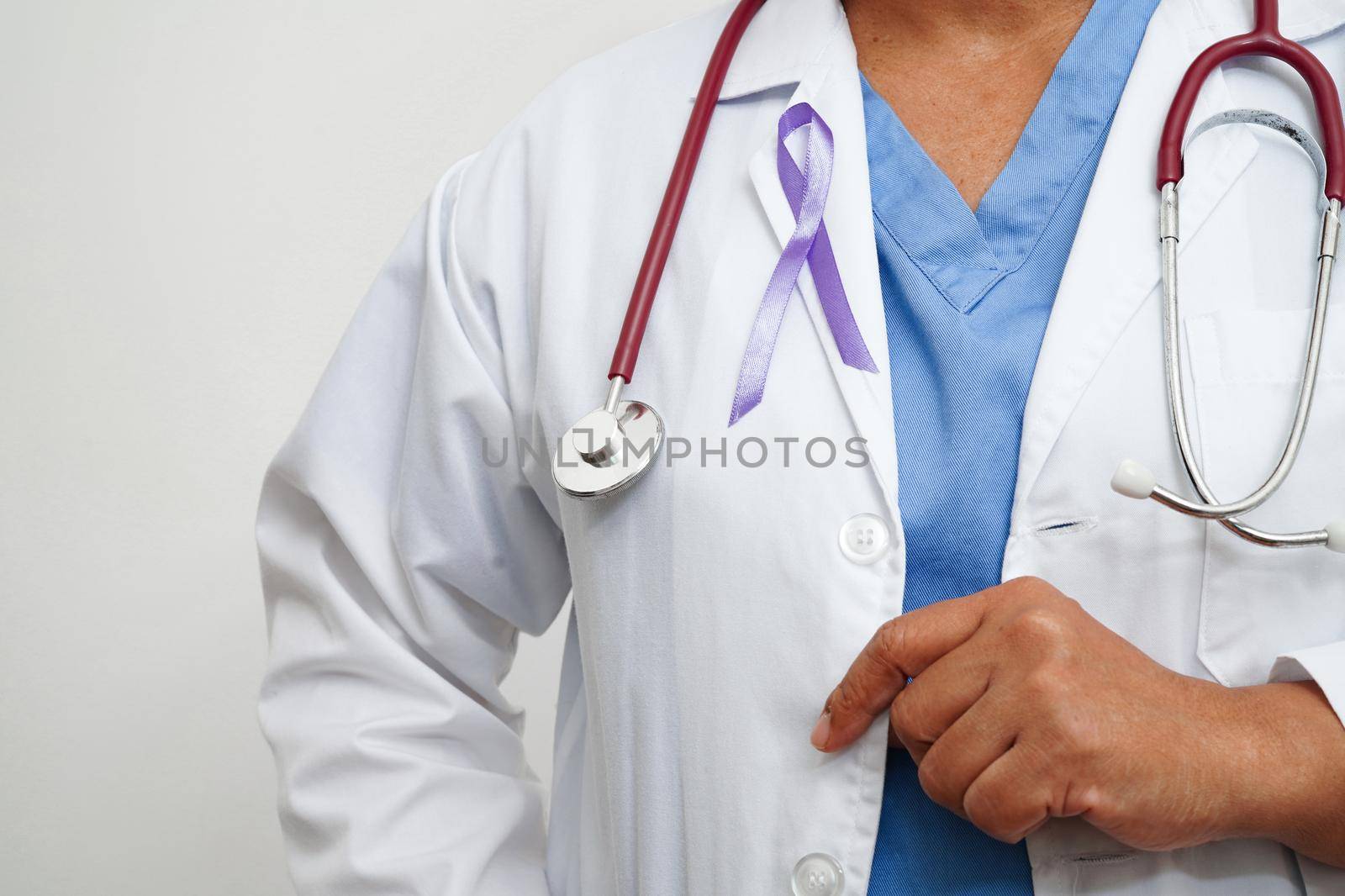 Asian woman doctor with purple ribbon, World Pancreatic Cancer day or World Alzheimer day.