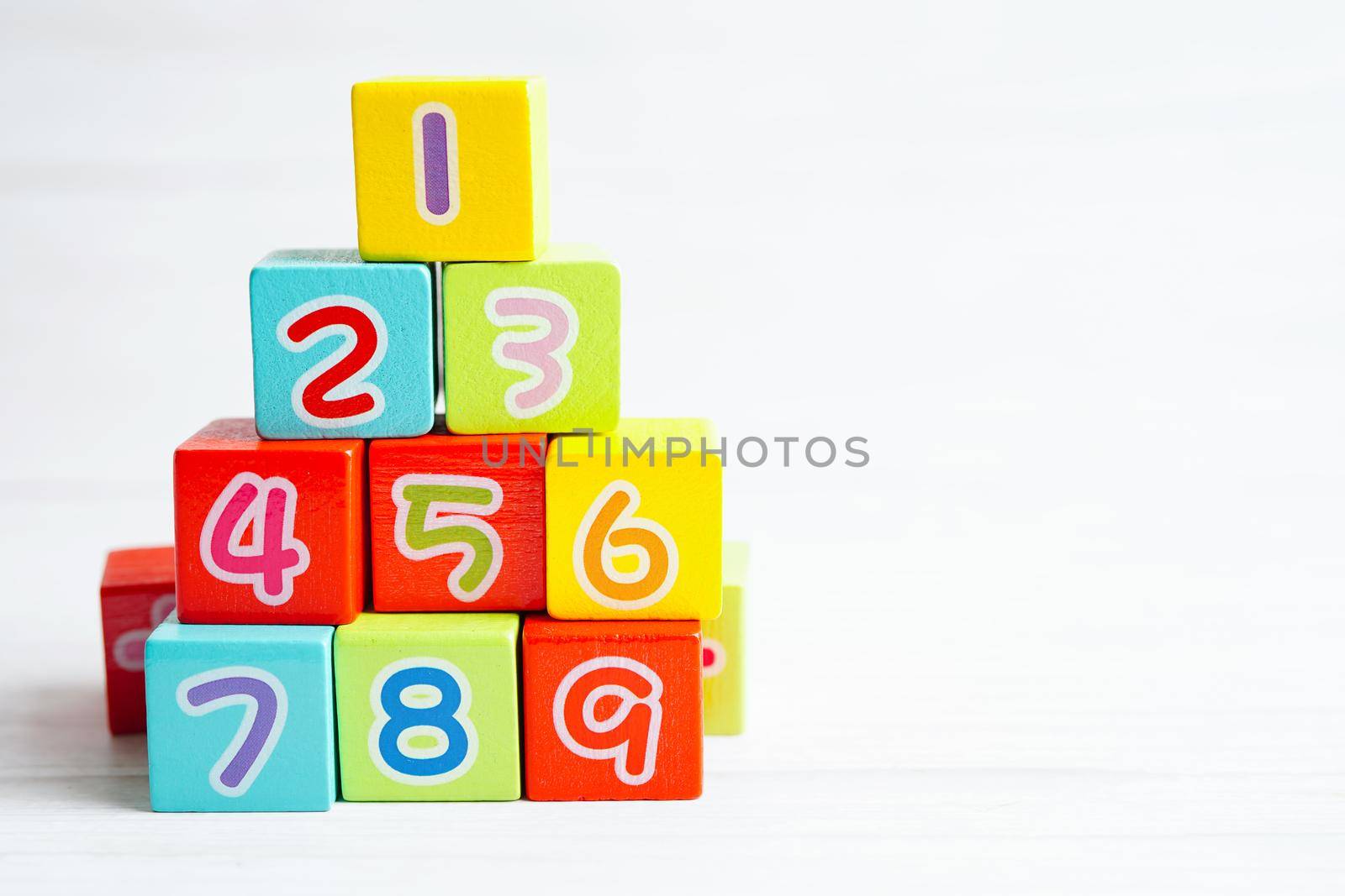 Number wood block cubes for learning Mathematic, education math concept.