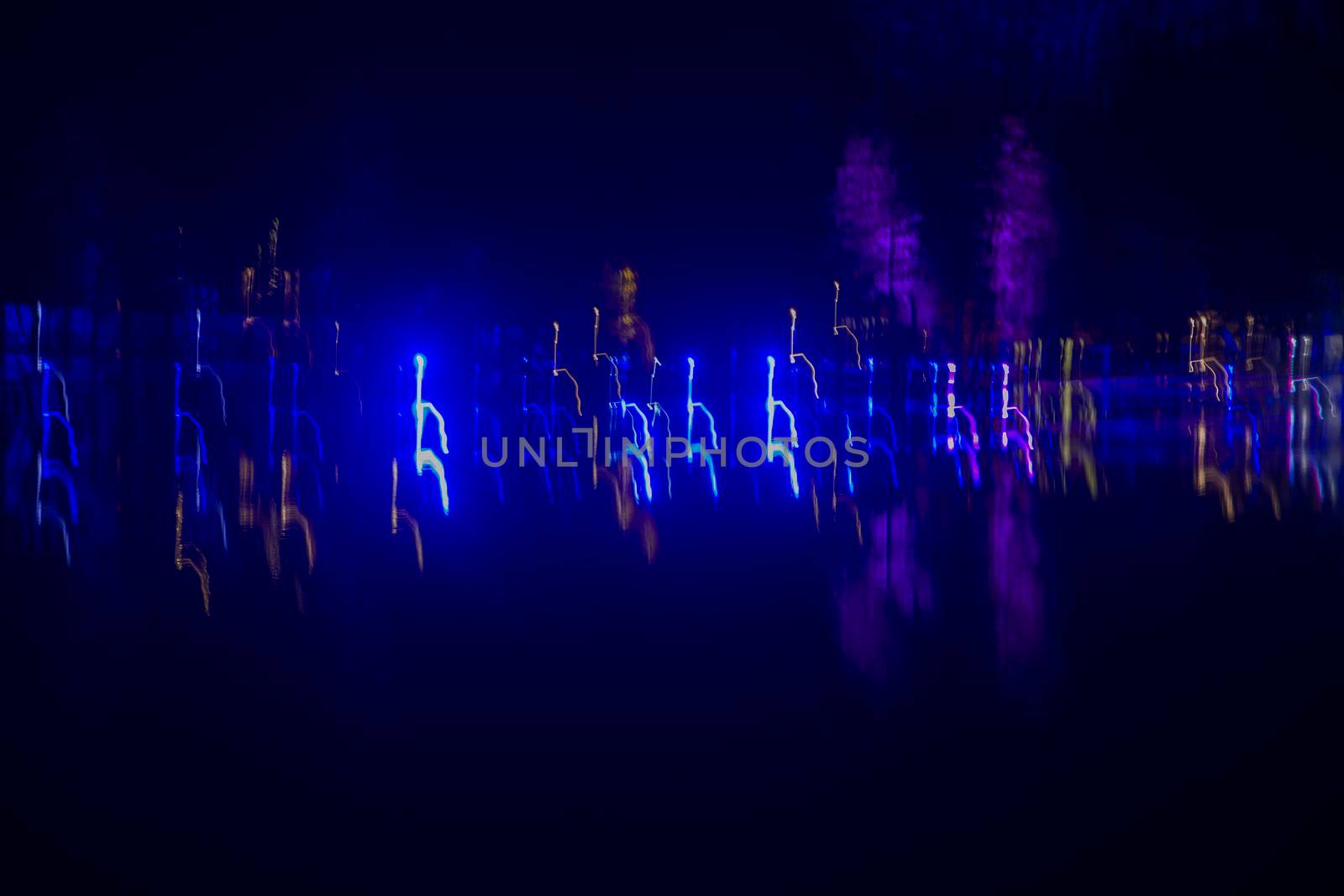 data visualization, neon blue and purple long exposure lights in night darkness, motion blur. High quality photo