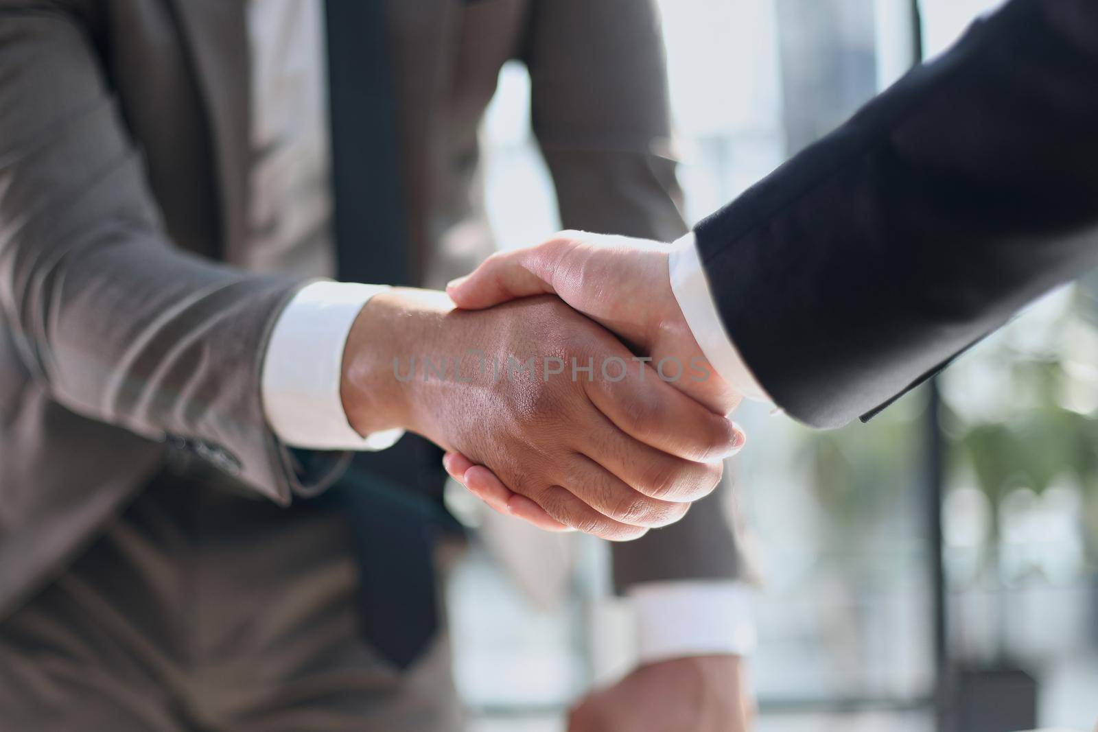 closeup of handshake of business partners by Prosto
