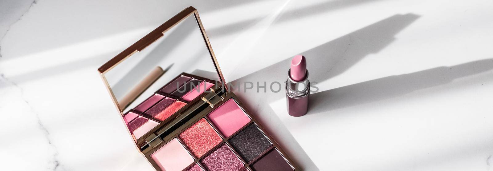 Cosmetics, makeup products set on marble vanity table, lipstick, eyeshadows and make-up brush for luxury beauty and fashion brand ads, holiday design by Anneleven