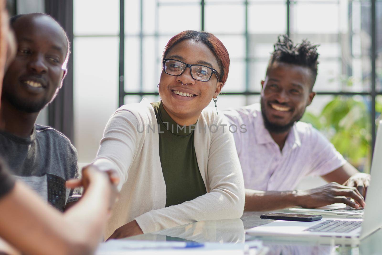 African american hr team welcoming female applicant at job interview by Prosto
