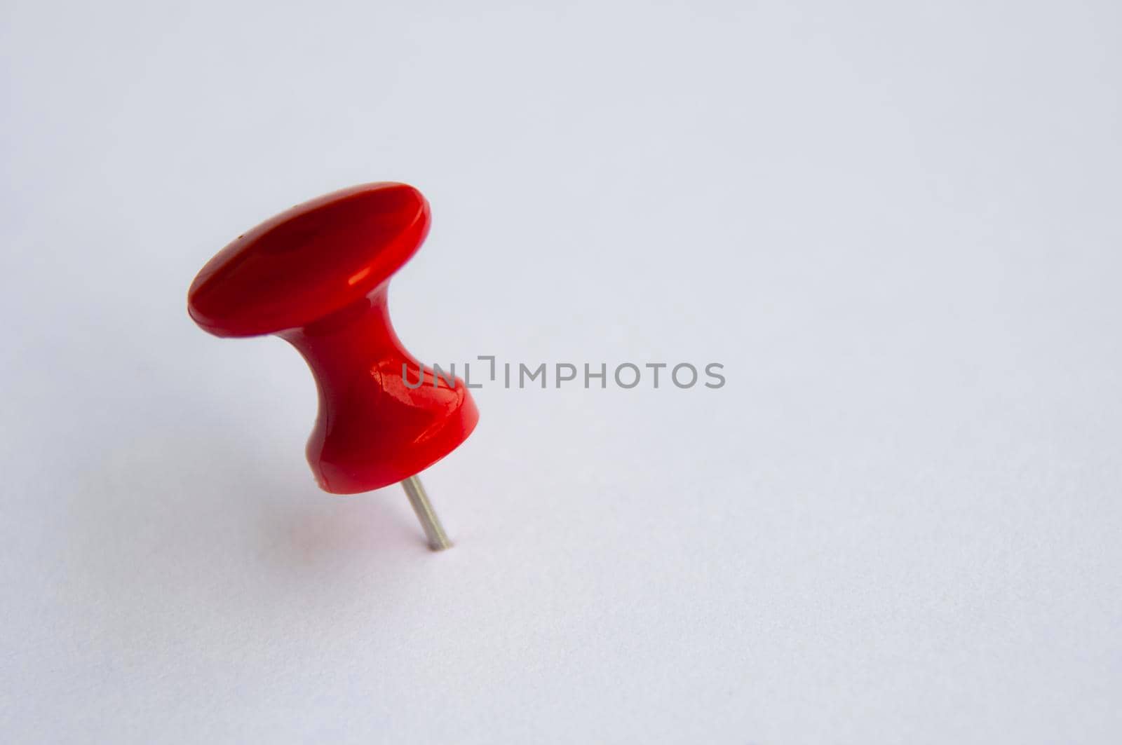 Red push pins isolated on white background. Copy space