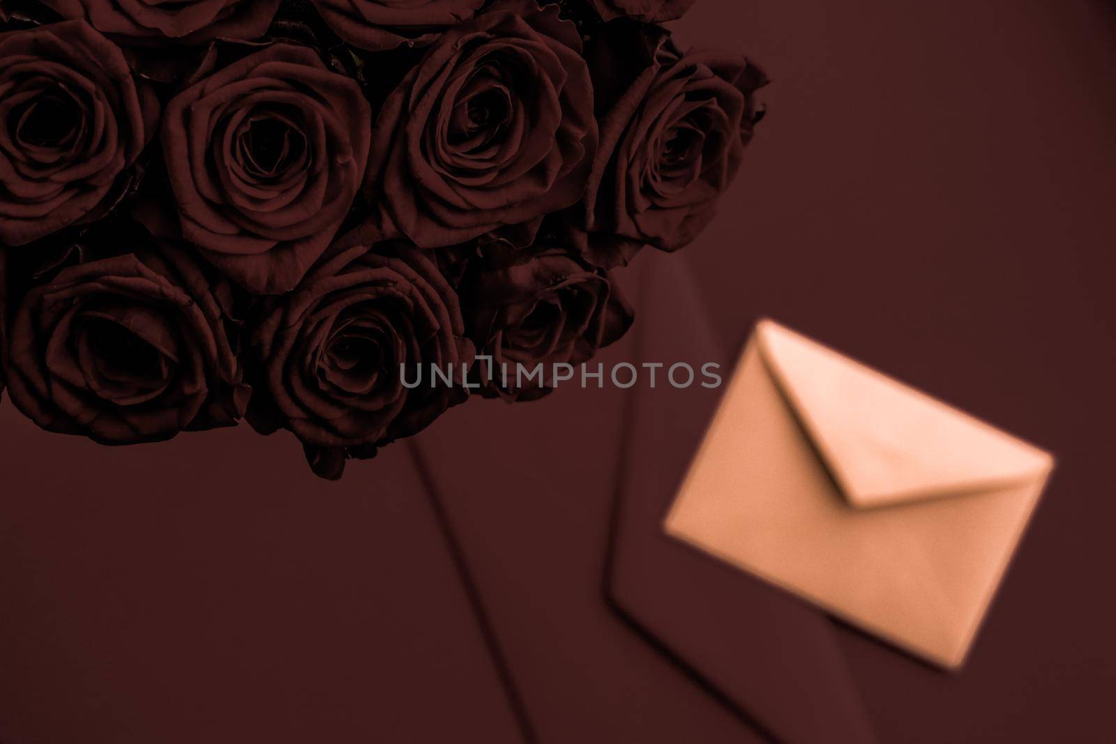 Holidays gift, floral present and happy relationship concept - Love letter and flowers delivery on Valentines Day, luxury bouquet of roses and card on chocolate background for romantic holiday design