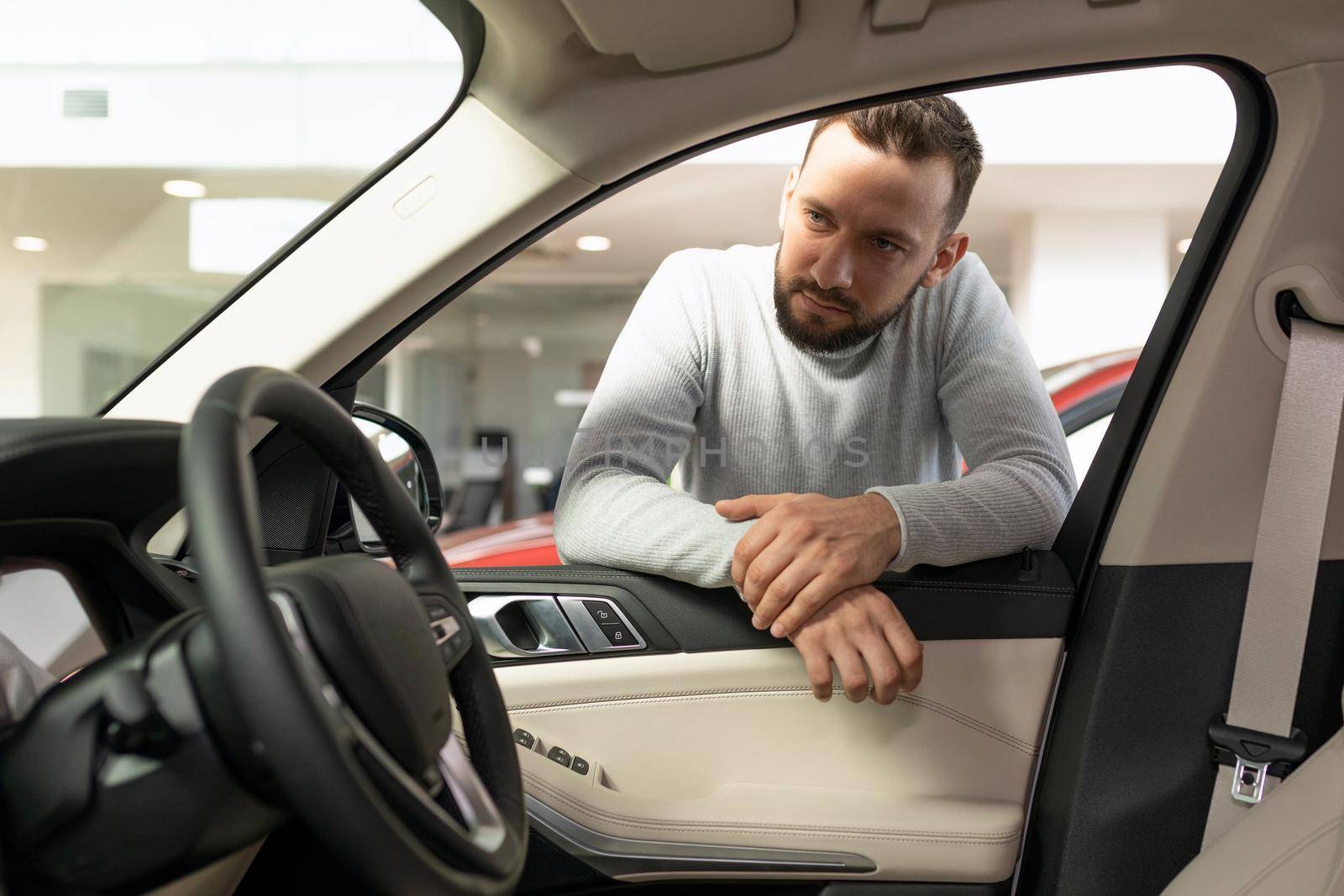 the man thought about buying a new car and an insurance policy.