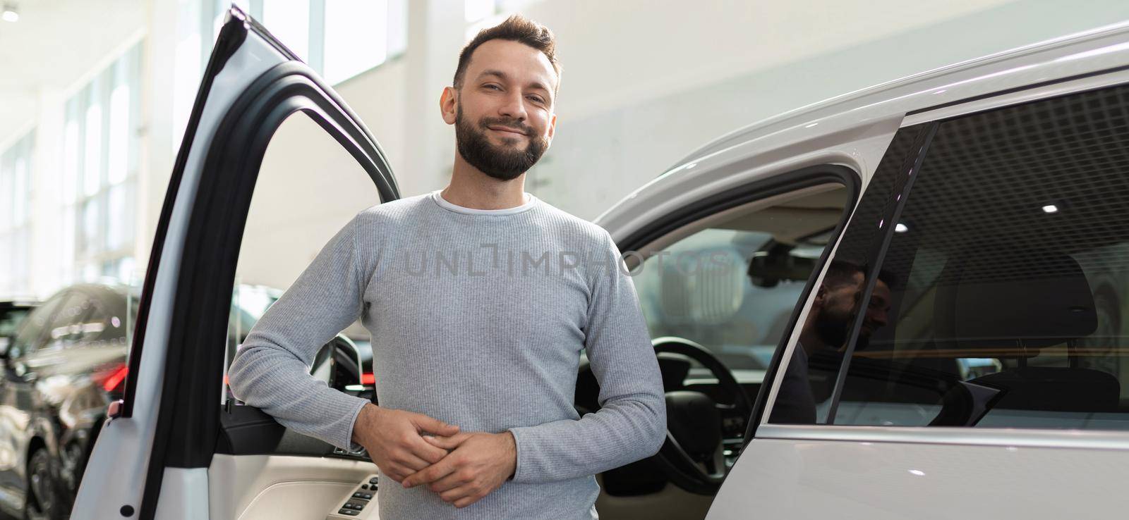 car and life insurance for driver and passengers, happy calm man.