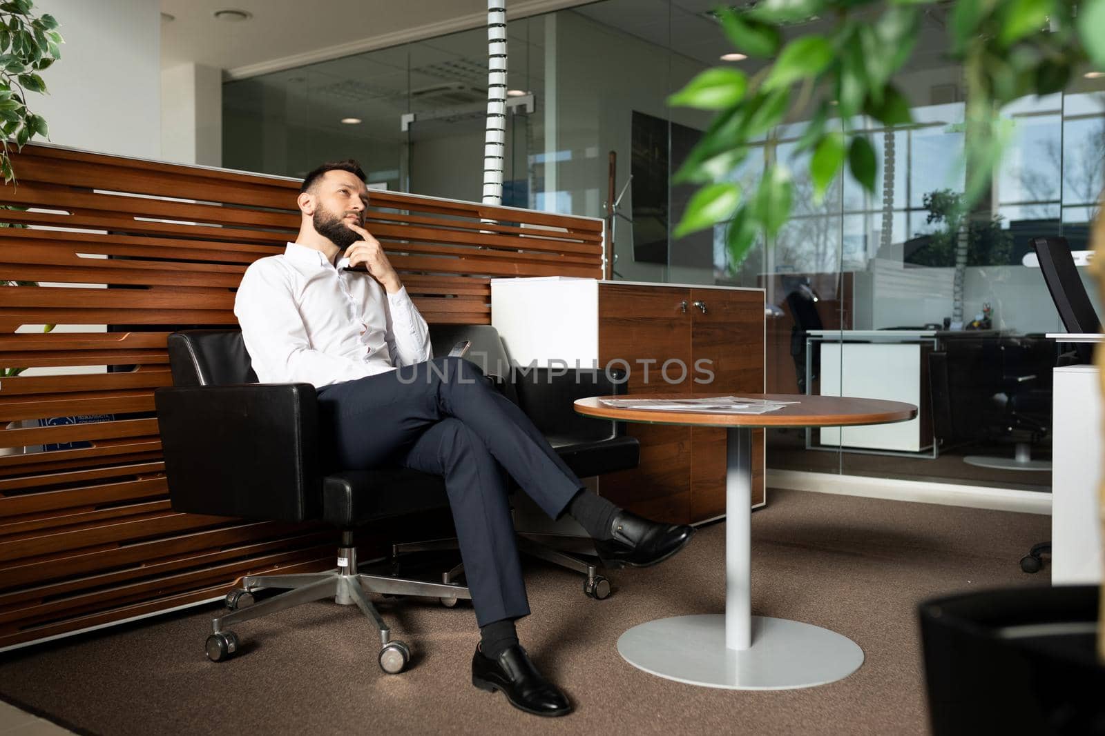 a man waiting in line for a job interview dreams of career success.