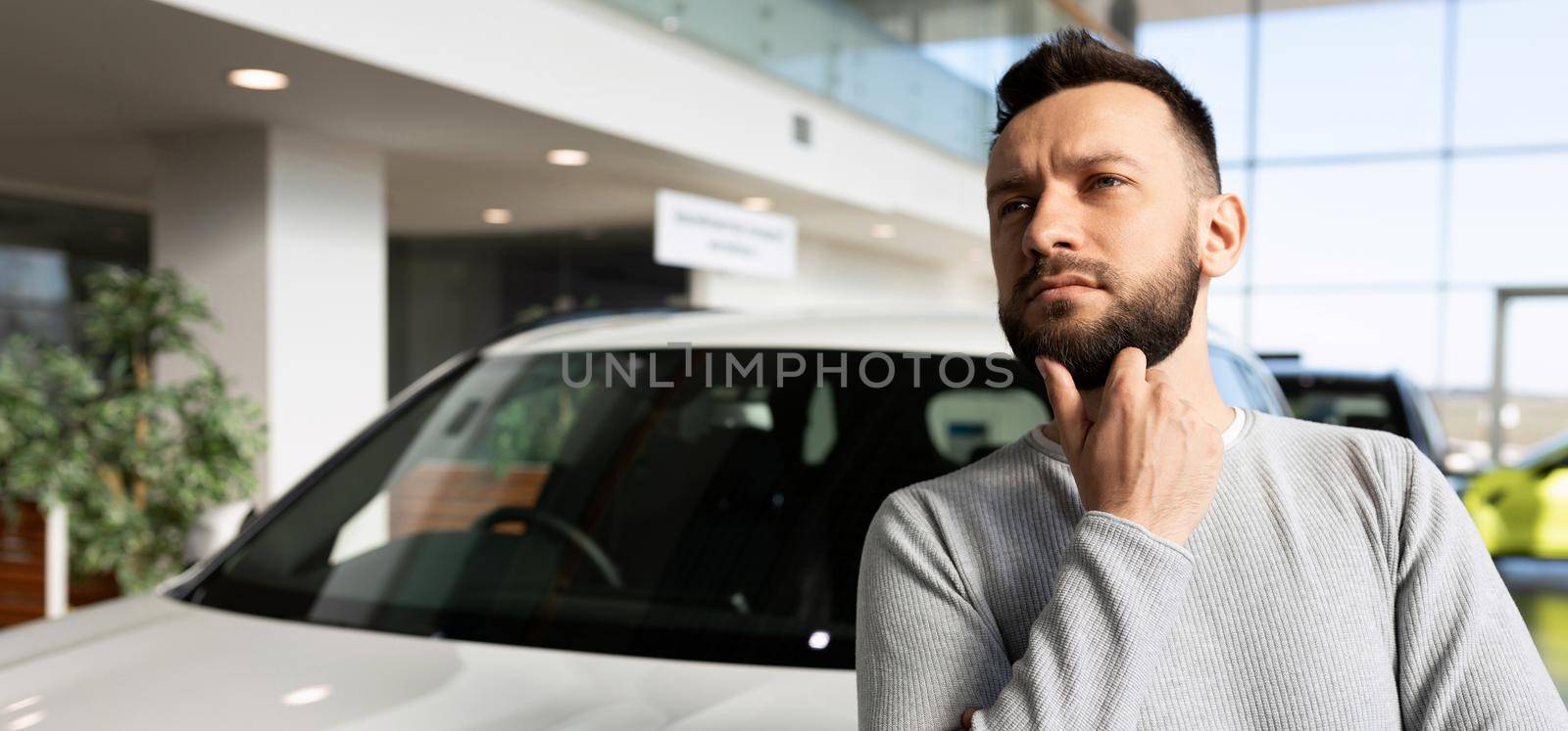 a man thought about buying a new car, a car from a car dealer on credit.