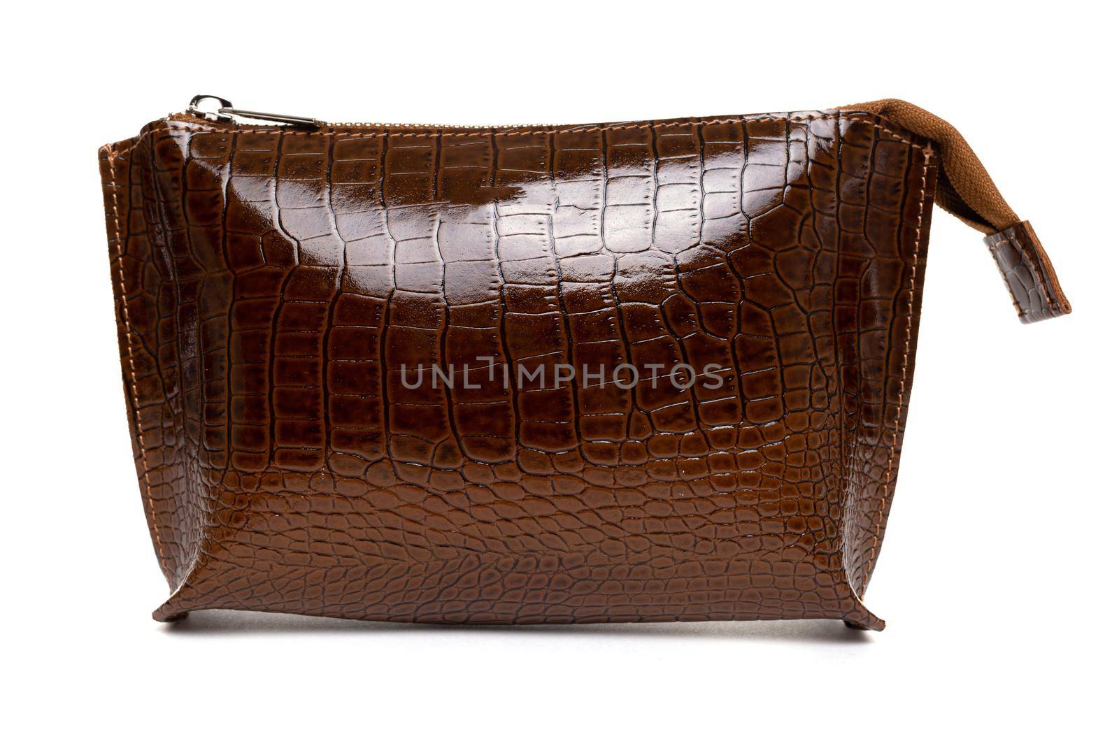 women's cosmetic bag made of genuine brown leather with imitation crocodile skin.