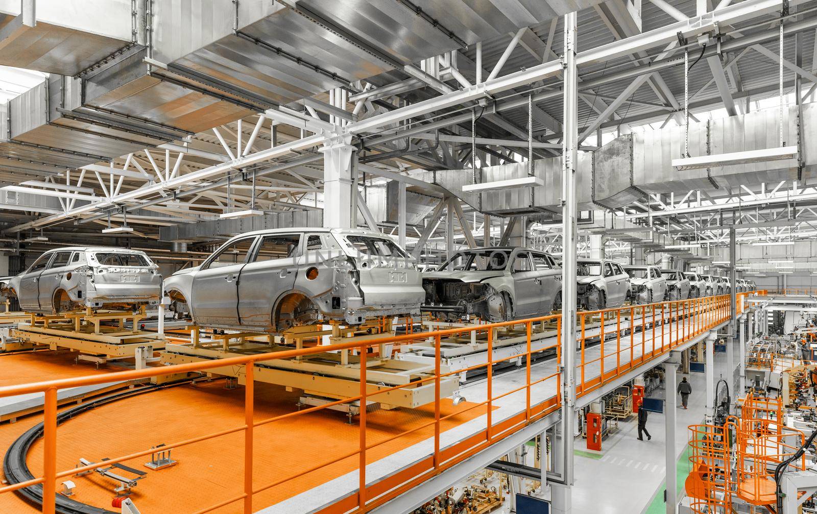 Automobile production line. Welding car body. Modern car assembly plant.