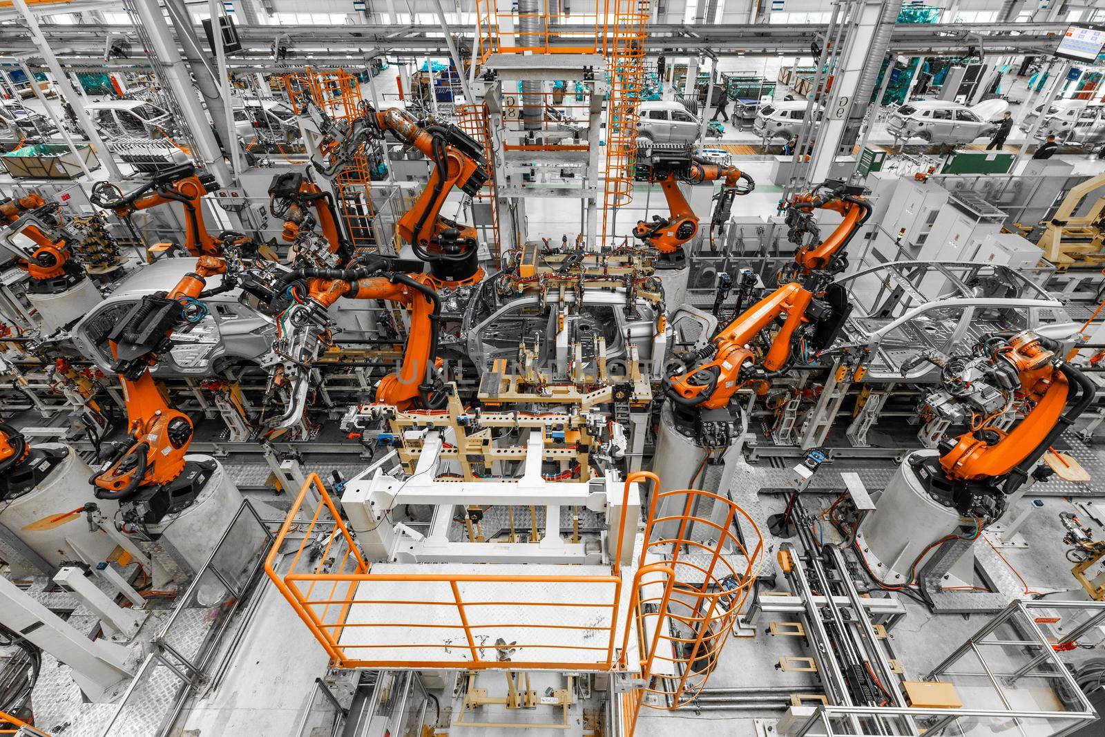 Photo of automobile production line. Welding car body. Modern car assembly plant. Top view.