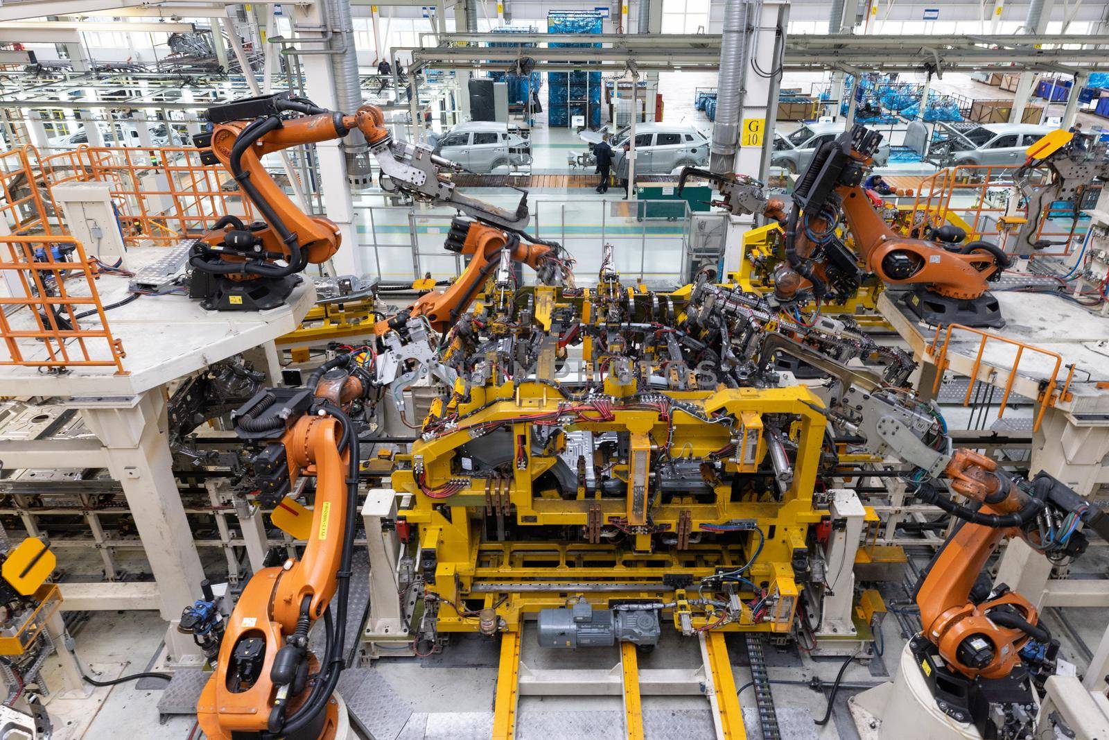 Car bodies are on assembly line. Factory for production of cars. Modern automotive industry. Top view.