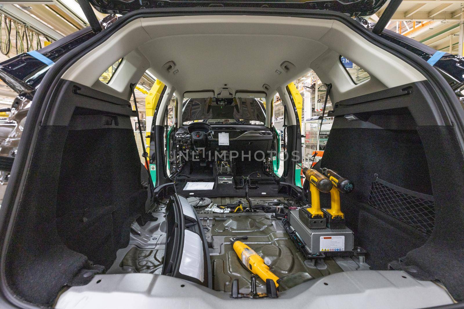 Automobile production line. Welding car body. Modern car assembly plant. Auto inside.