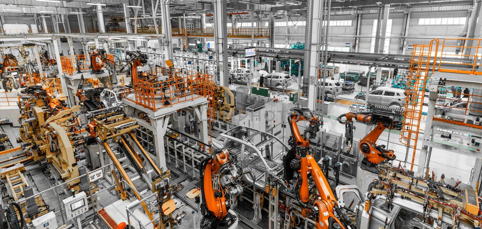 Panoramic Photo. Automobile production line. Welding car body. Modern car assembly plant.