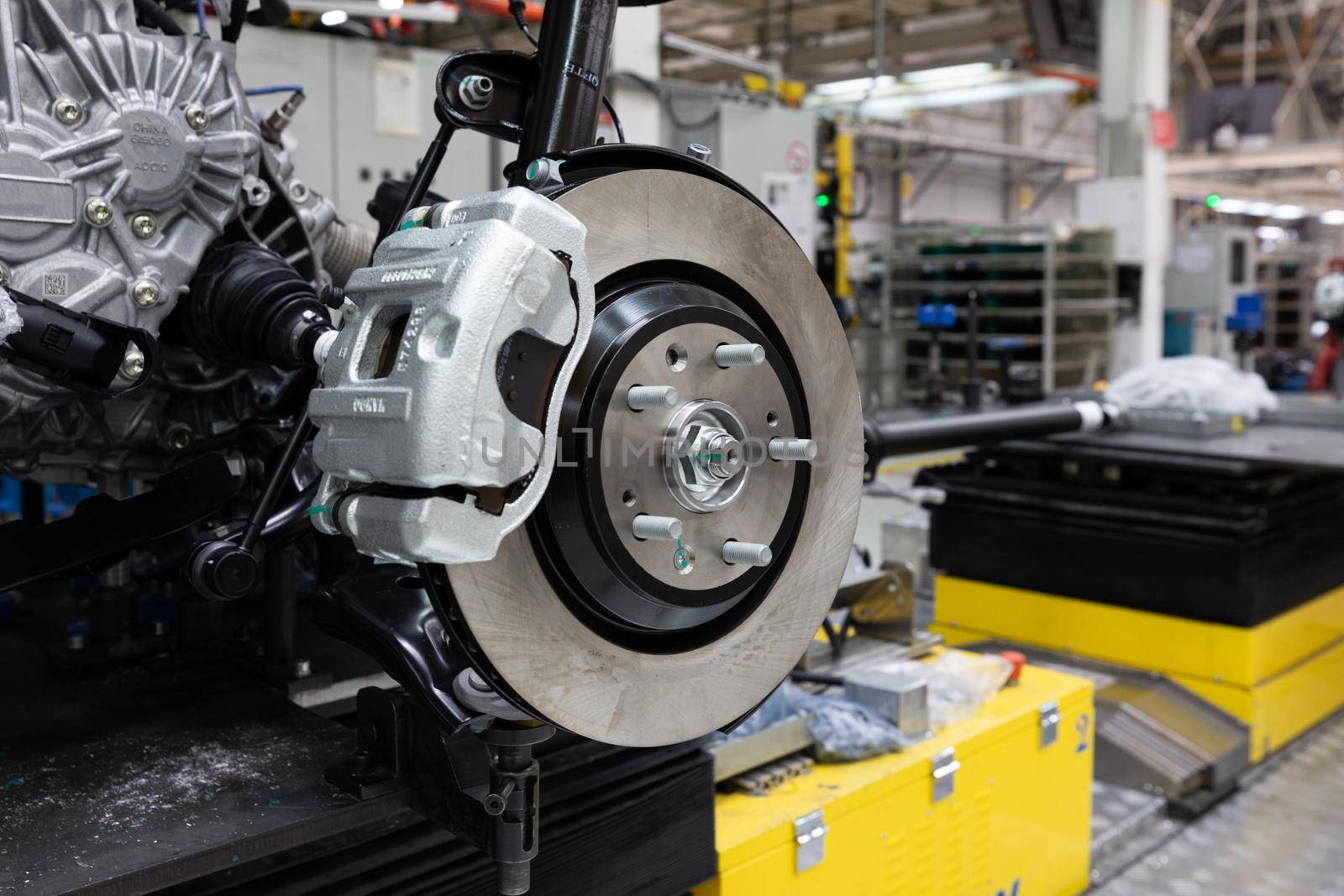 Photo of car bodies are on assembly line. Factory for production of cars. Modern automotive industry.