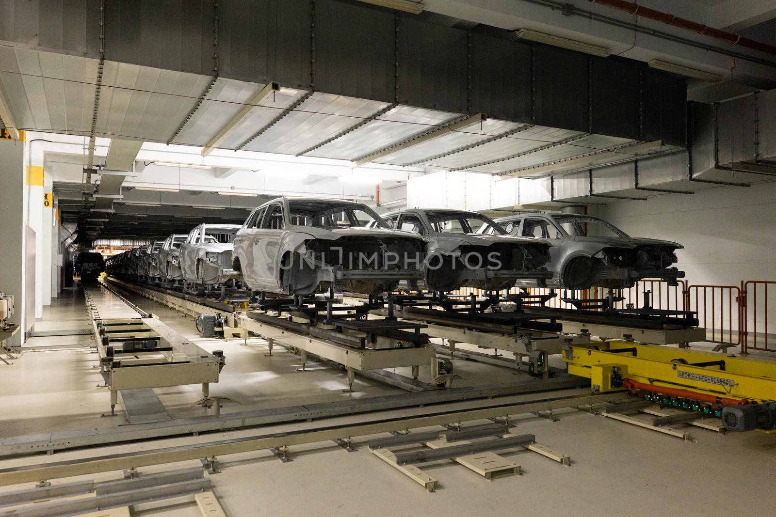 Car bodies are on assembly line. Modern automotive industry. Automobile conveyor.