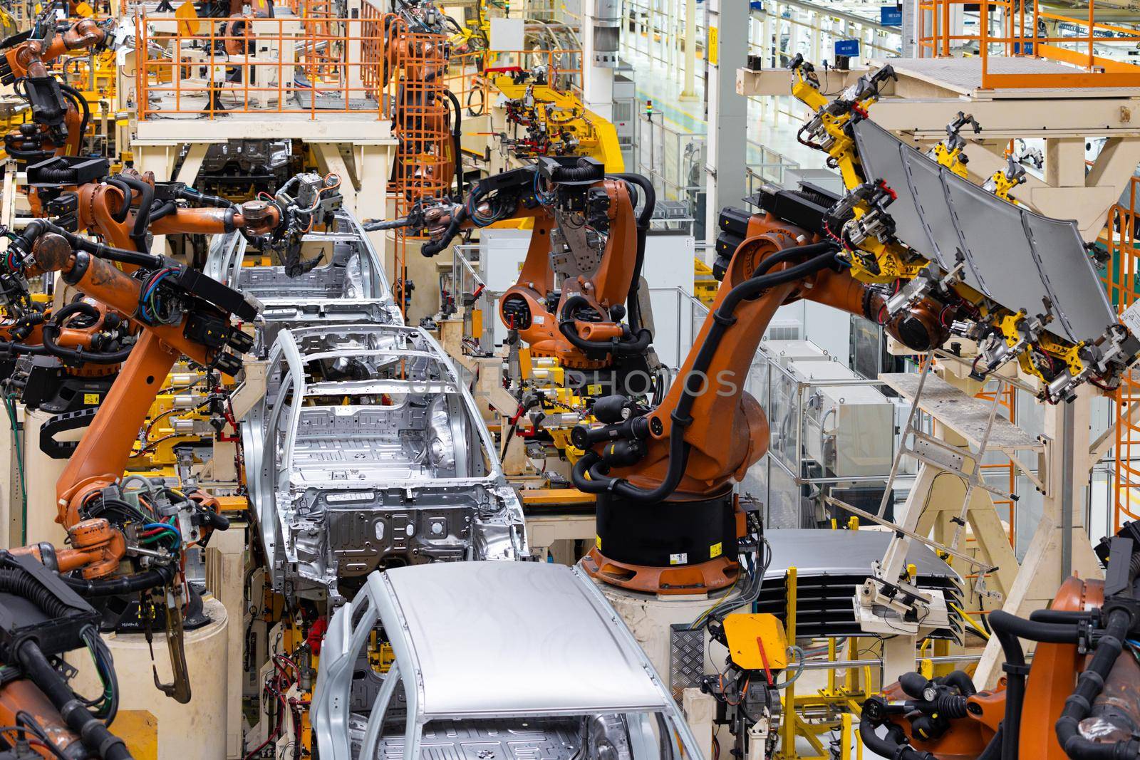 Car bodies are on assembly line. Factory for production of cars. Modern automotive industry. Top of view.