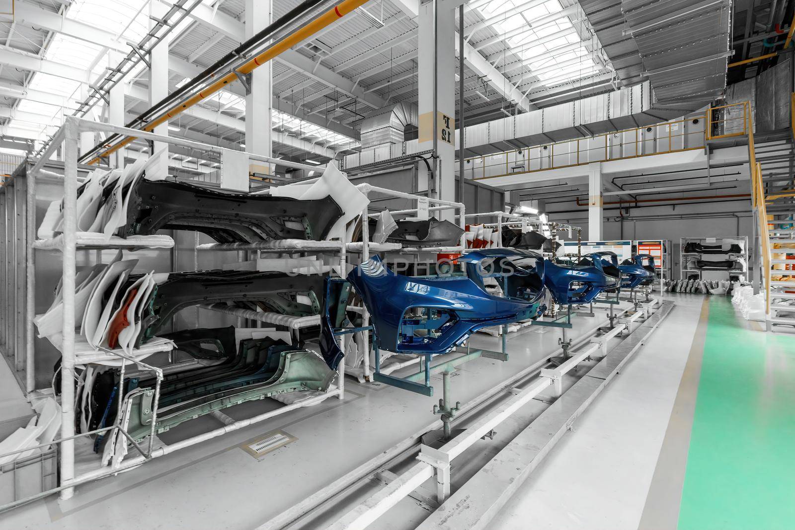 Photo of a warehouse with shelves with spare parts for cars and automobiles.