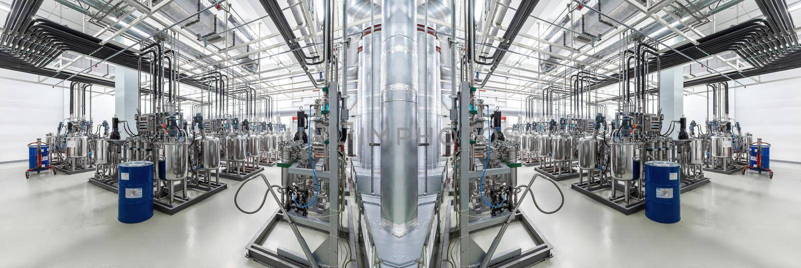 Panoramic mirror photo of pipes and tanks. Chemistry and medicine production. Pharmaceutical factory. Interior of a high-tech factory, modern production.