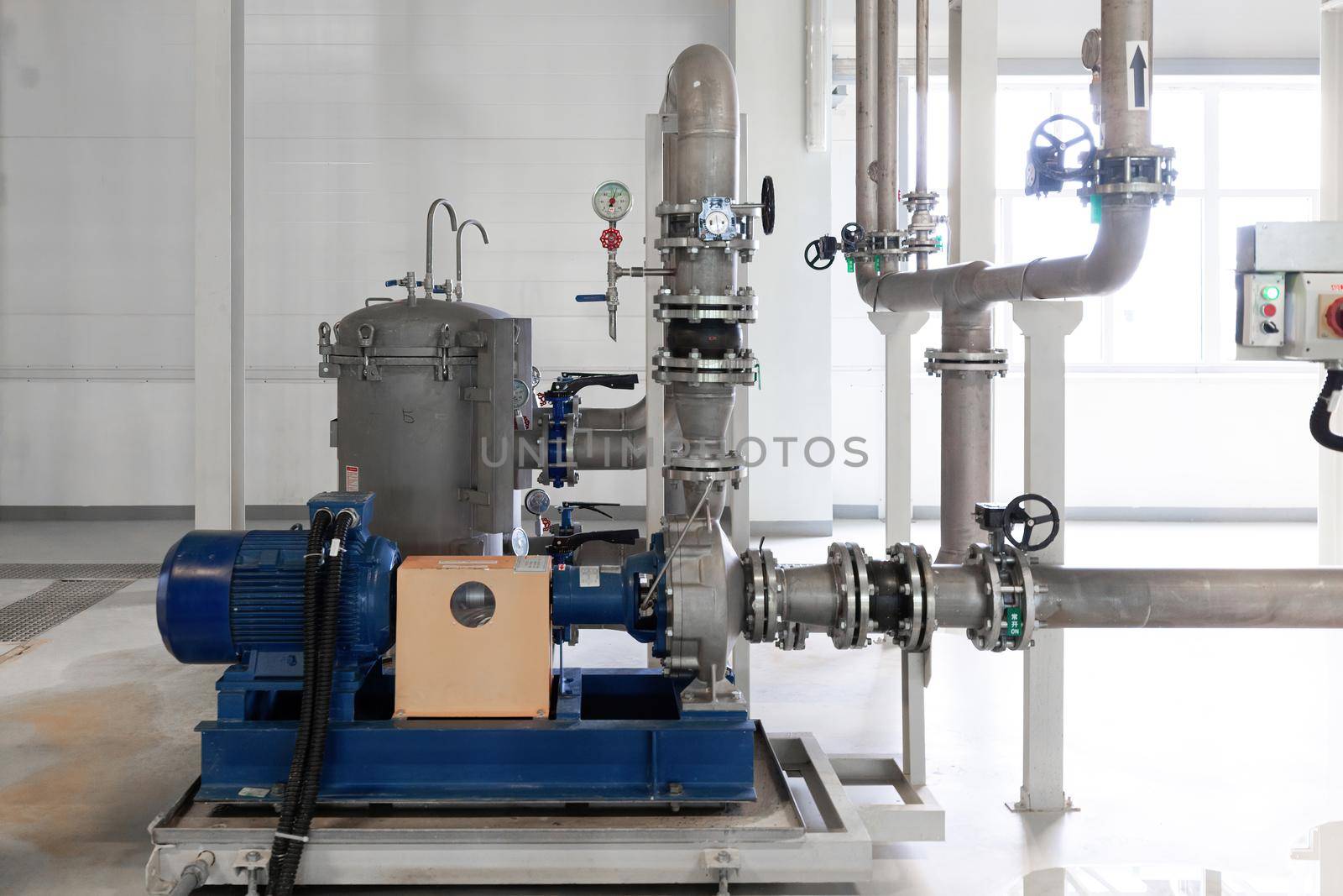 Closeup photo of pipes and tanks. Chemistry and medicine production. Pharmaceutical factory.