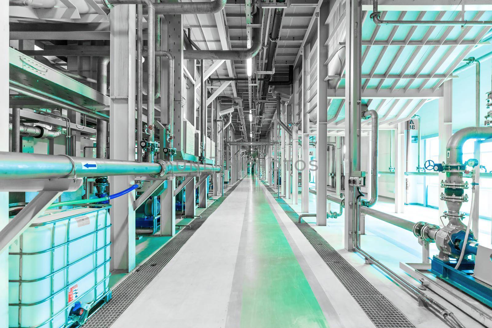 Photo of plant interior, modern enterprise, pumping station. Green tone.