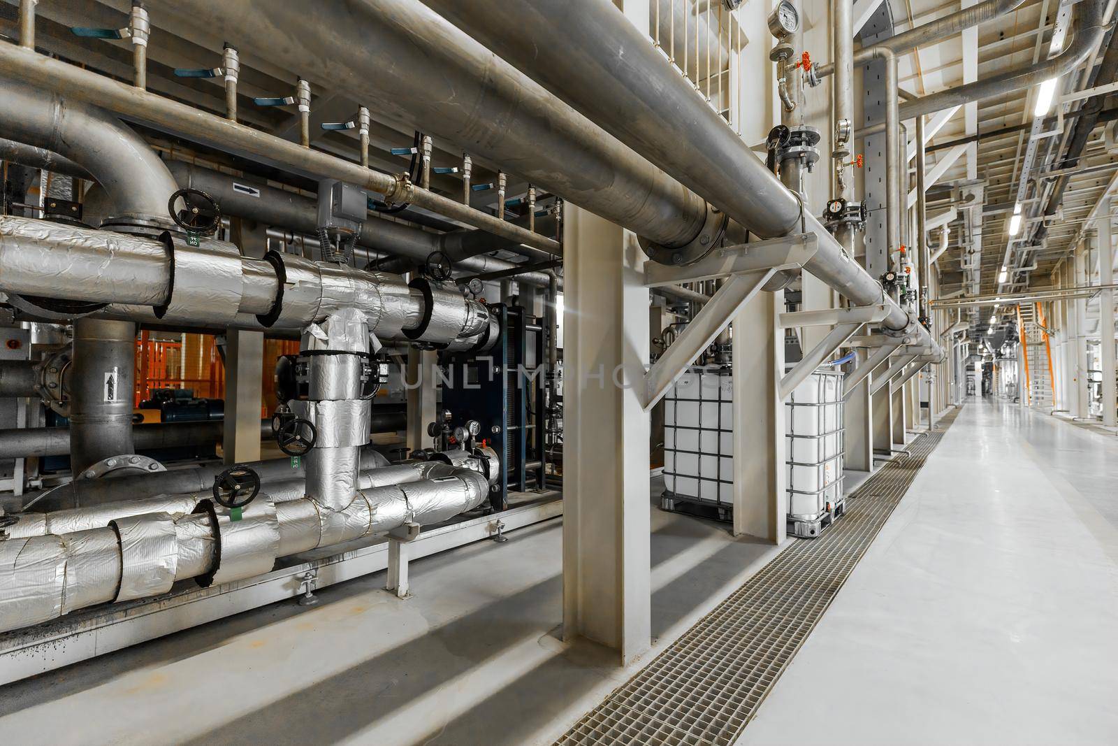 Photo of pipes and tanks. Chemistry and medicine production. Pharmaceutical factory. Interior of a high-tech factory, modern production.