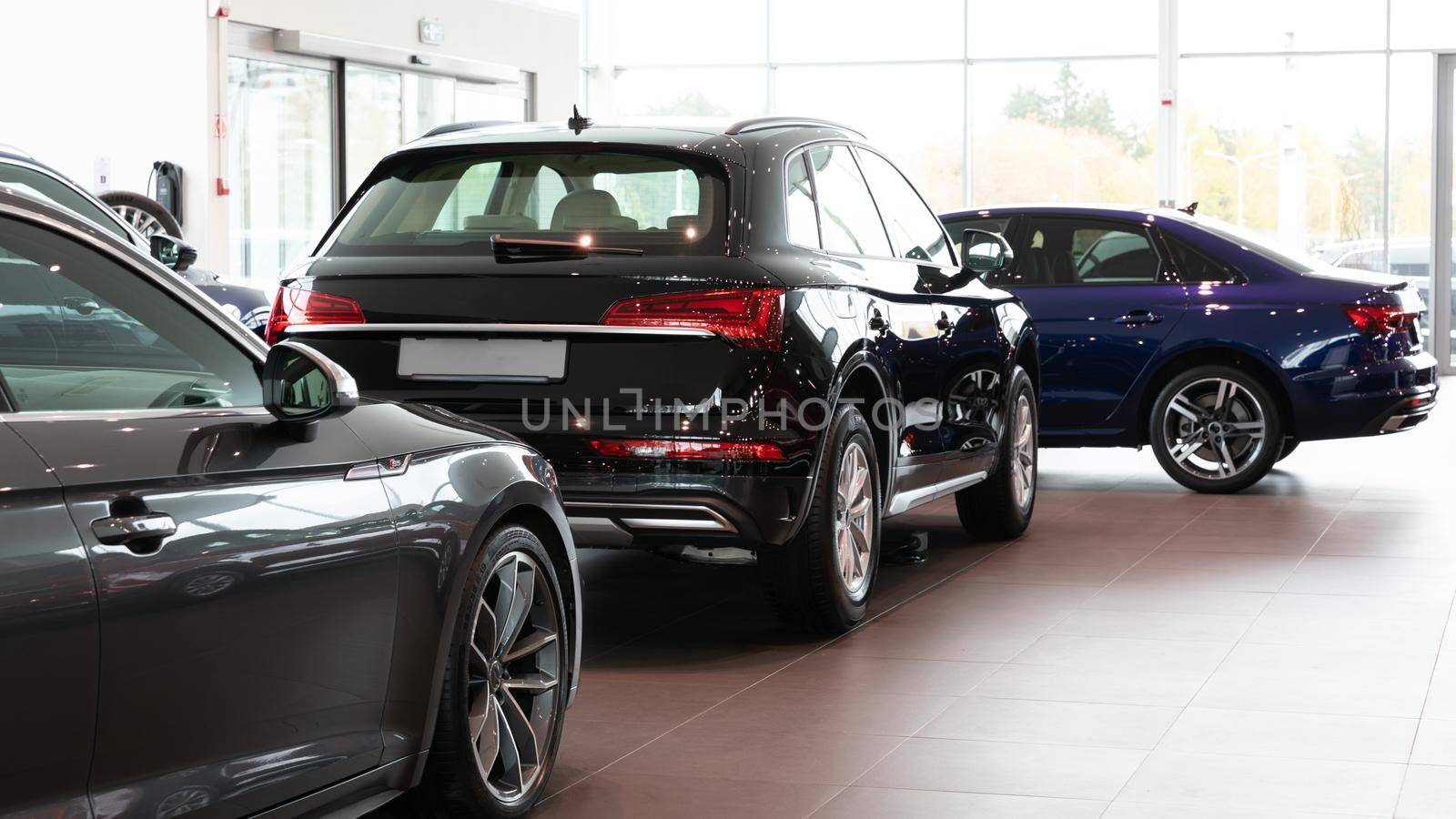 luxury SUV car showroom, cars in a row.