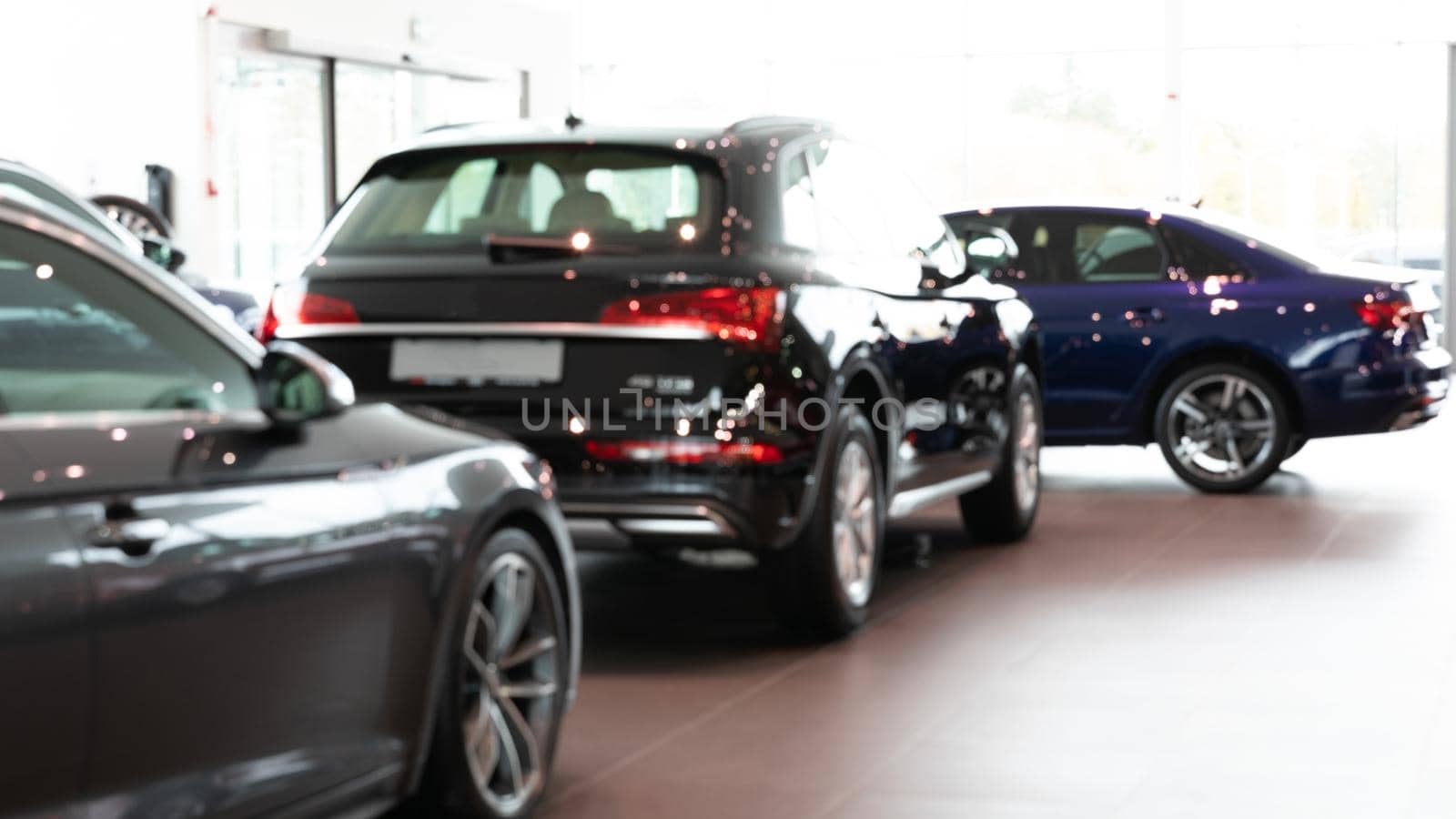 dealership selling premium SUVs, blurred photo with depth of field for background.