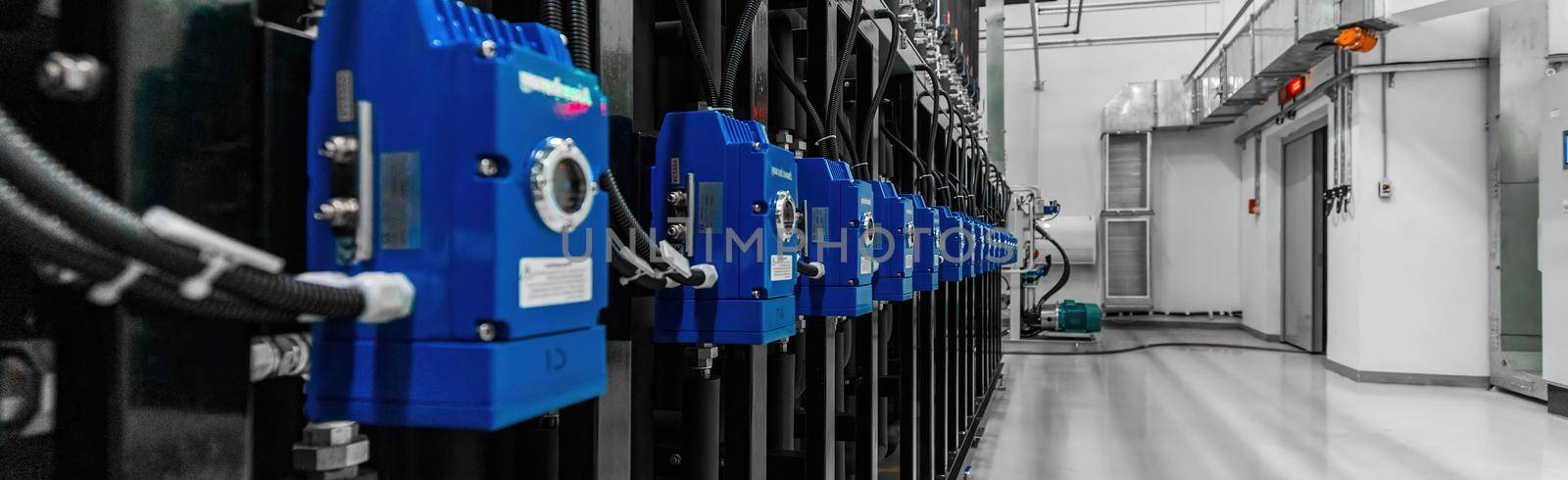 Close-up panoramic photo of stainless steel pipes in the factory. Chemistry and medicine production. Pharmaceutical high-tech plant interior and modern production.