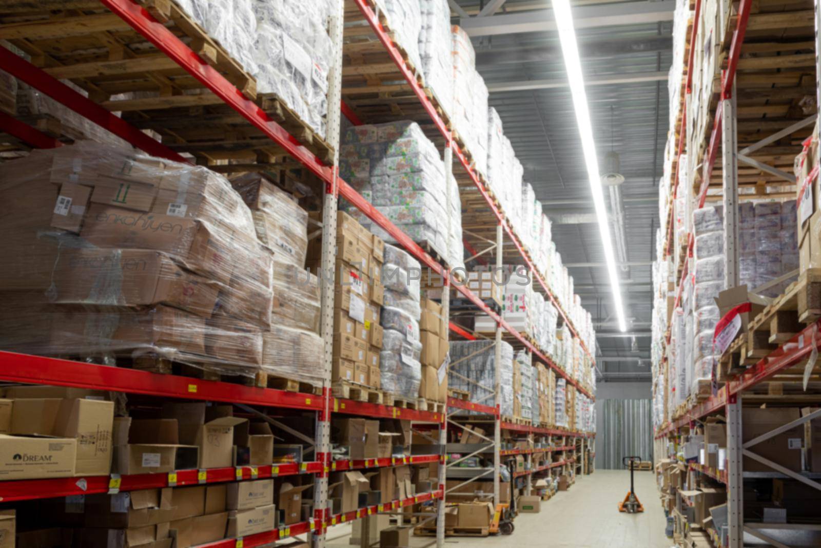 automated warehouse complex with high-bay shelving, blurred photography, defocus by TRMK