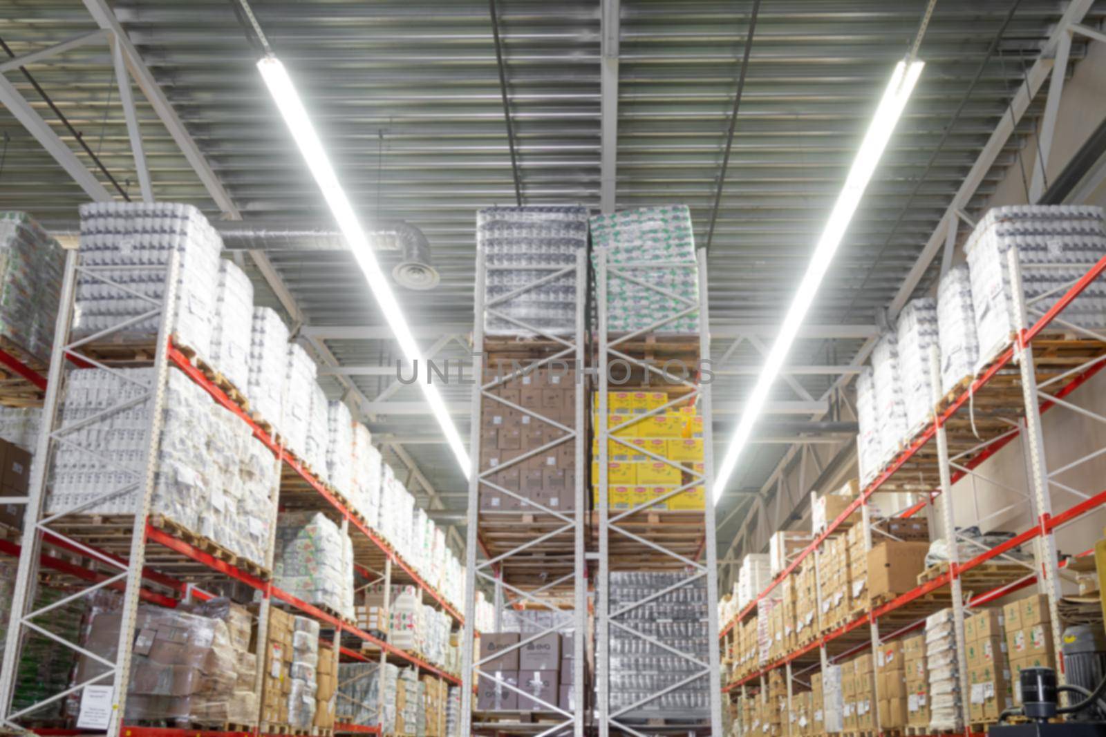 panoramic photo of an automated warehouse logistics center with high-bay shelving, blurred photography, defocus by TRMK
