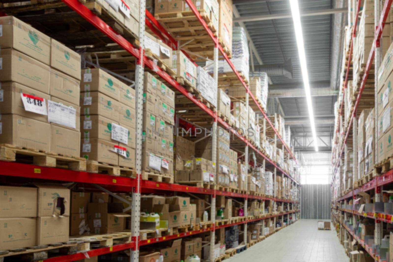 warehouse in the logistics center with boxes ready for shipment, blurred photography, defocus by TRMK