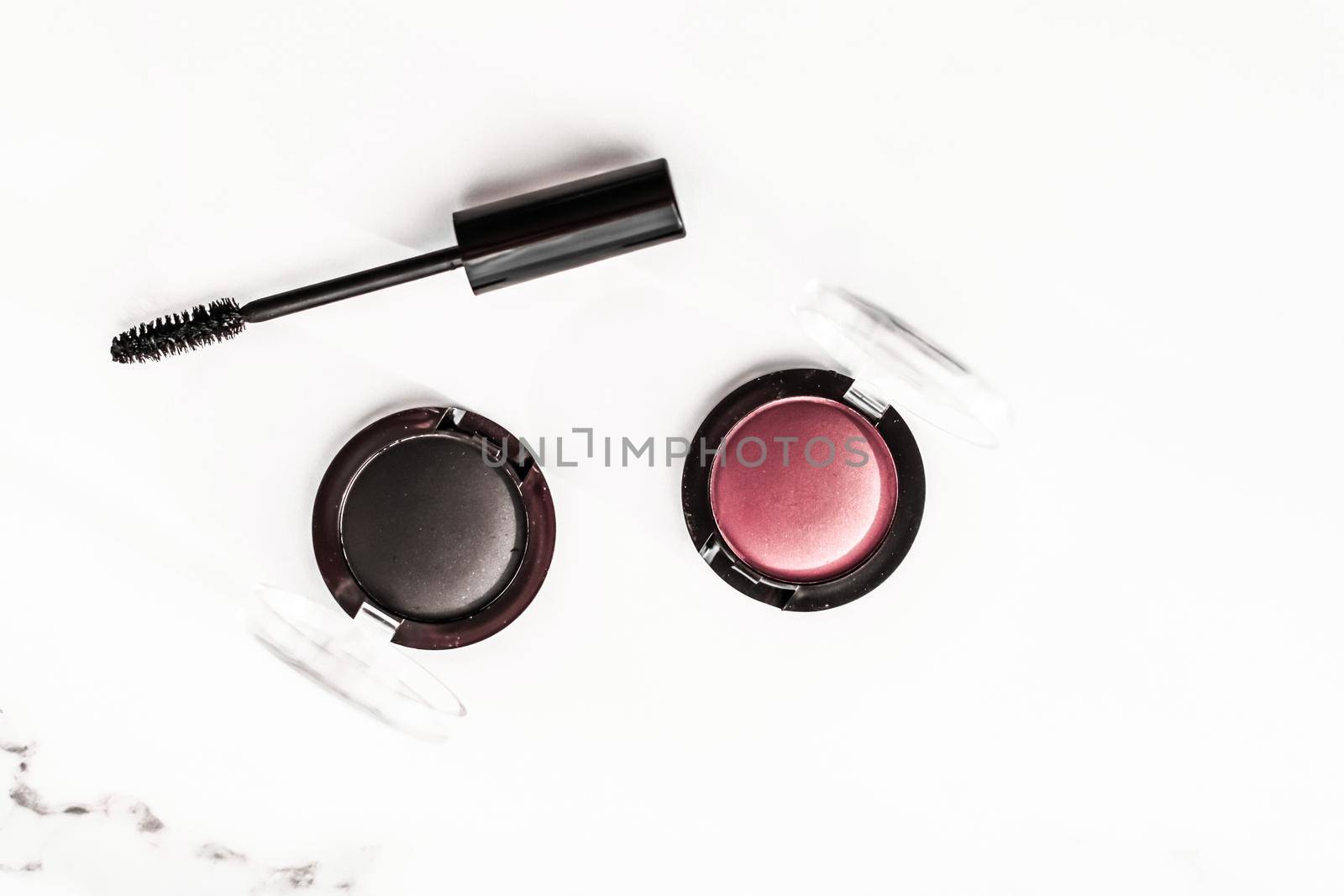 Cosmetic branding, blog and girly concept - Eyeshadows, black liner and mascara on marble background, eye shadows cosmetics as glamour make-up products for luxury beauty brand, holiday flatlay design