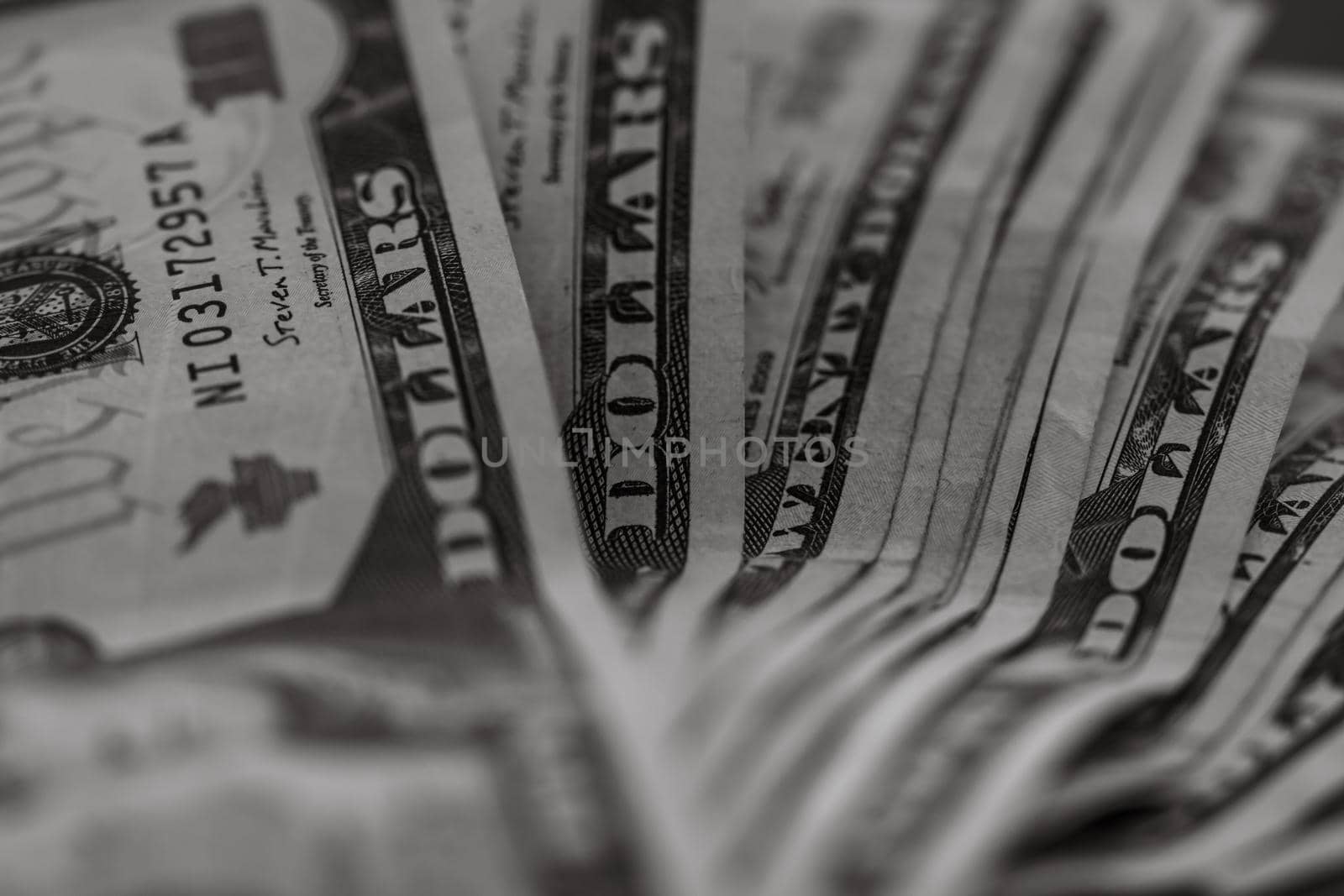 Selective focus on detail of dollars banknotes. Close up macro detail of money banknotes, dollars isolated. World money concept, inflation and economy concept