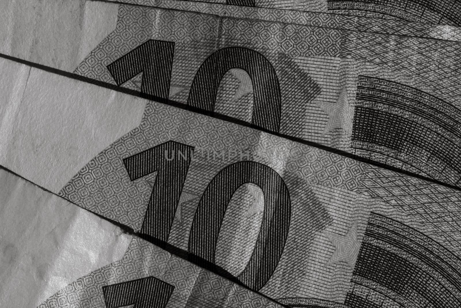 Selective focus on detail of euro banknotes. Close up macro detail of money banknotes, 10 euro isolated. World money concept, inflation and economy concept by vladispas