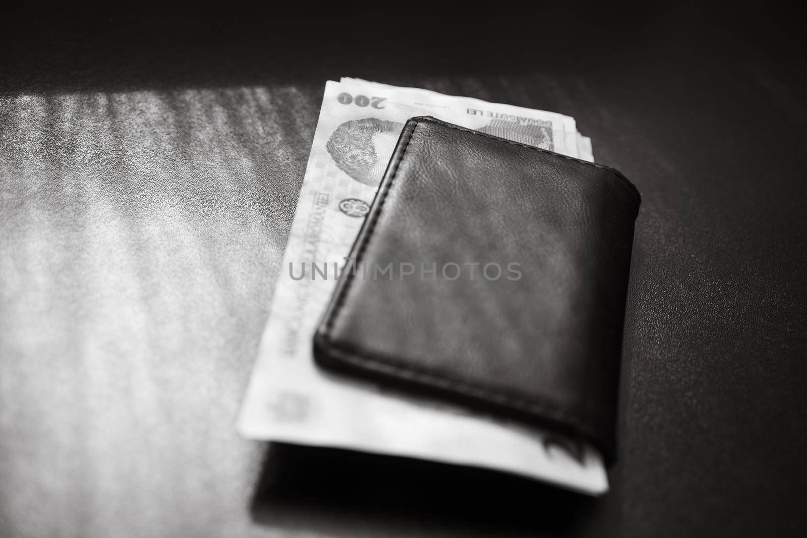 Man wallet with money on the table, wallet with LEI