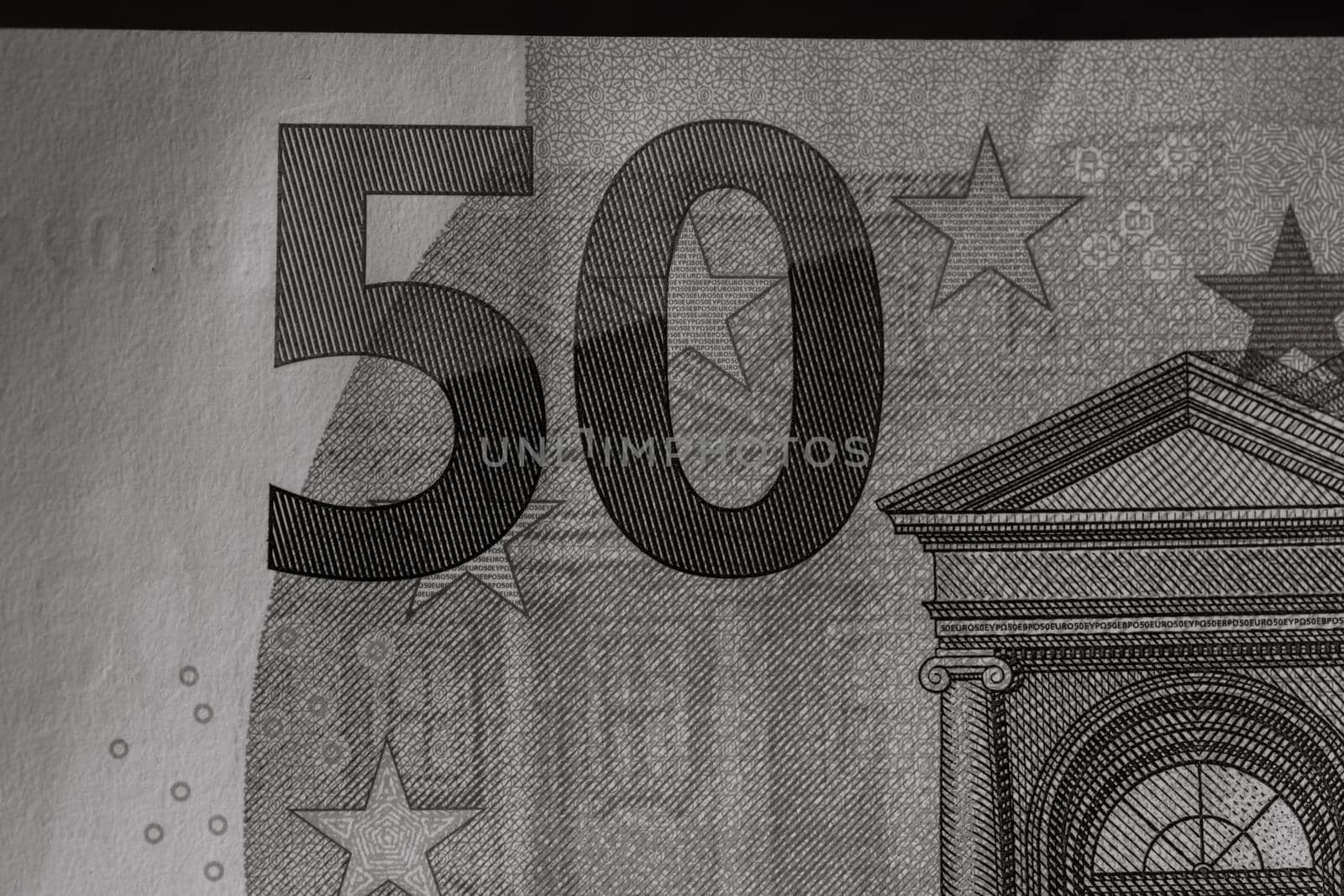 Selective focus on detail of euro banknotes. Close up macro detail of money banknotes, 50 euro isolated. World money concept, inflation and economy concept by vladispas