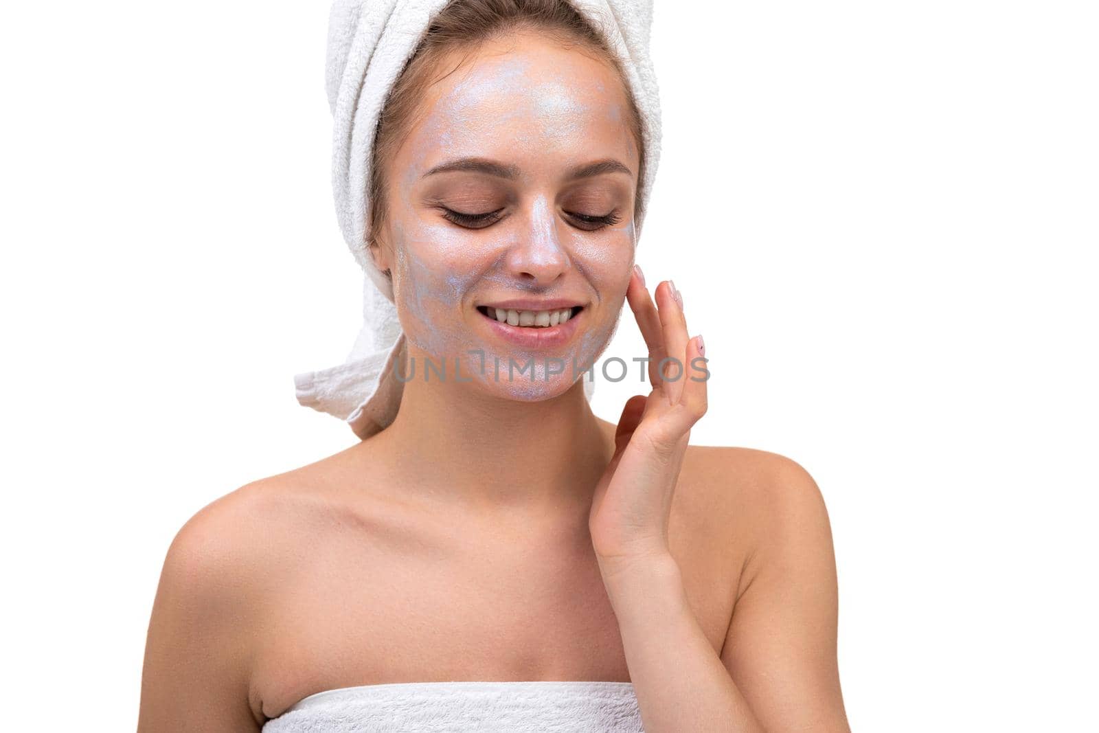 woman after shower with pearl mask on her face, skin care concept.