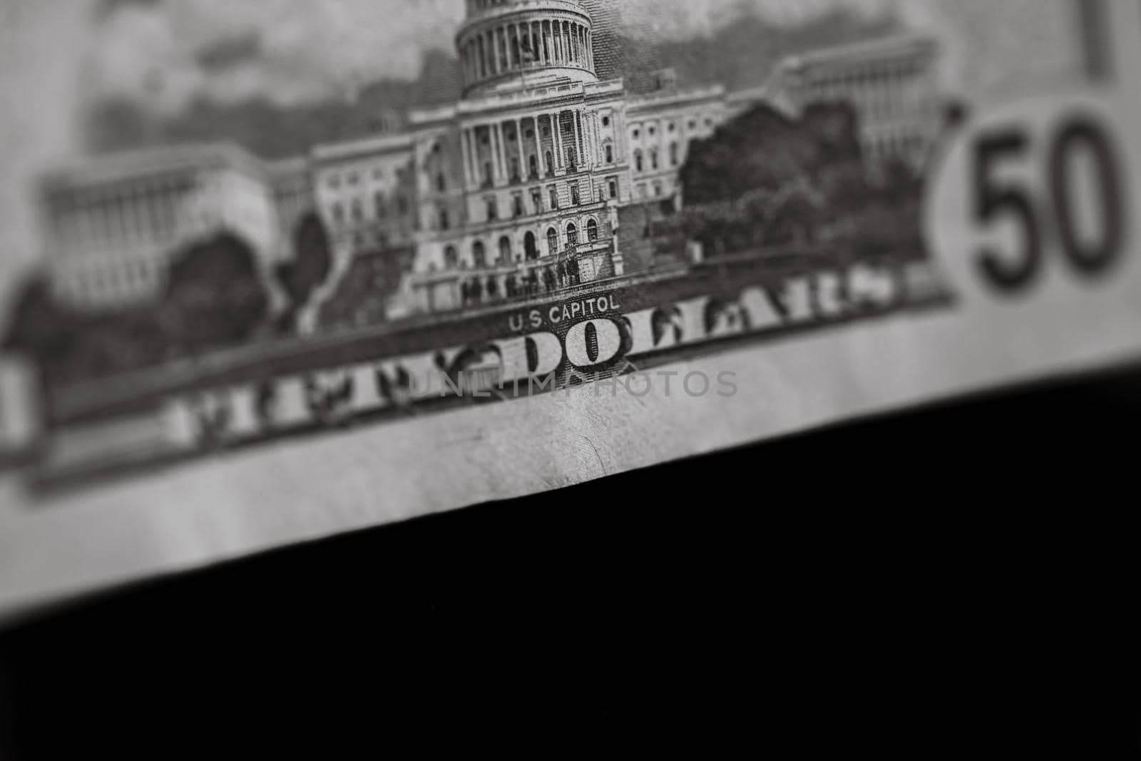 Selective focus on detail of 50 dollars banknote. Close up macro detail of money banknotes, dollars isolated. World money concept, inflation and economy concept